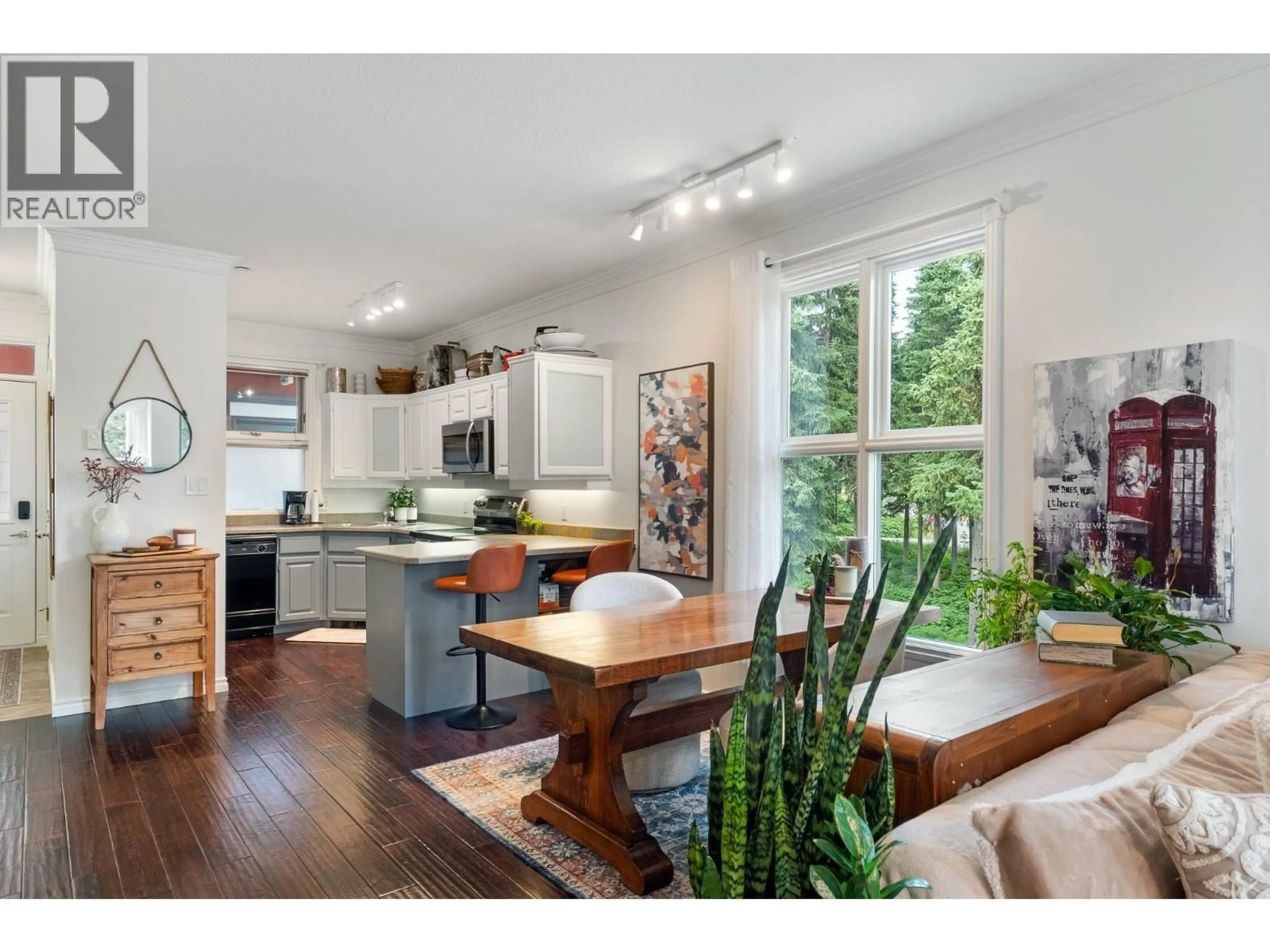 Open concept kitchen, wood/laminate floor for 101 - 357 MONASHEE ROAD, Vernon British Columbia V1B3M1