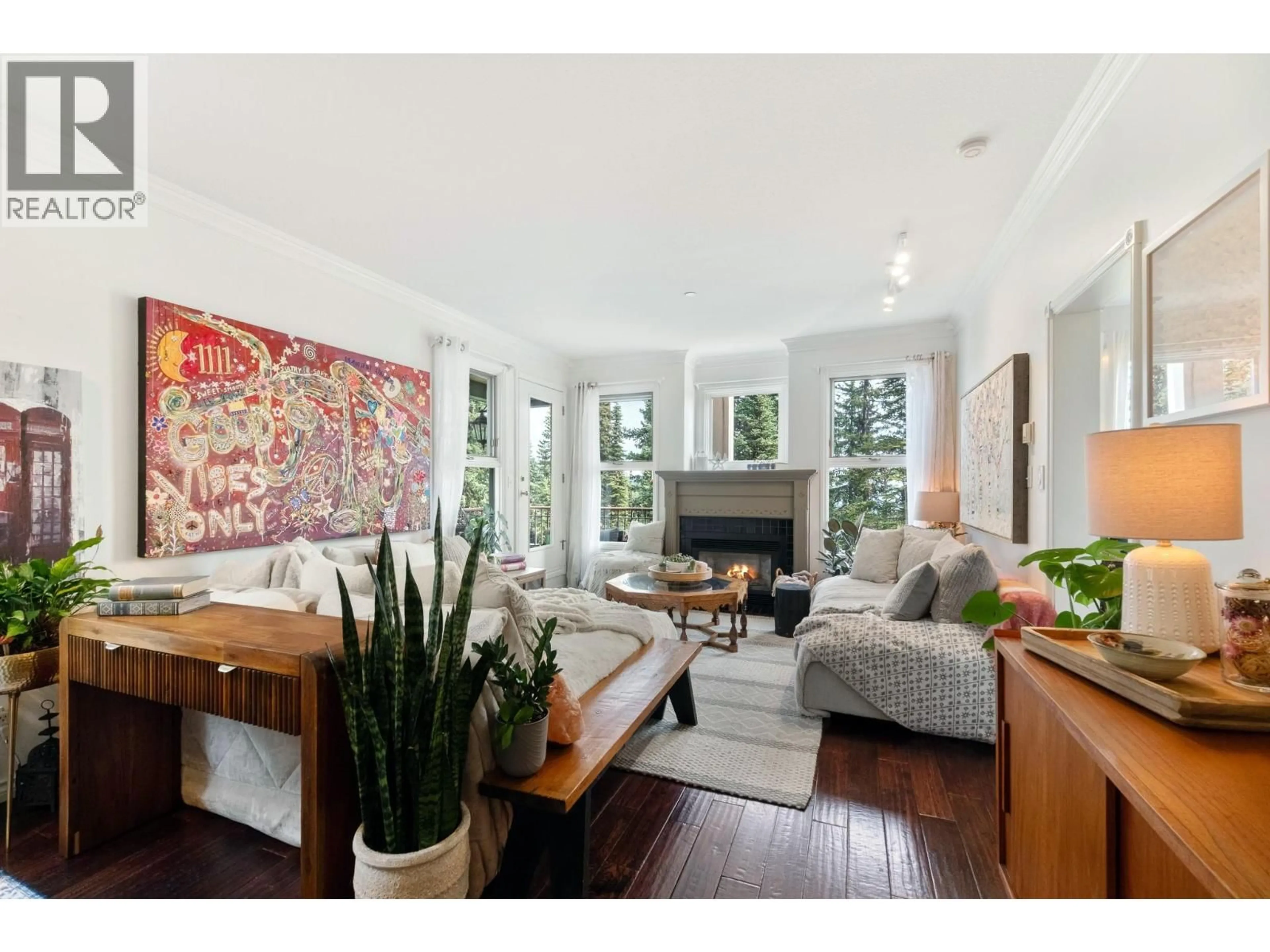 Living room with furniture, wood/laminate floor for 101 - 357 MONASHEE ROAD, Vernon British Columbia V1B3M1