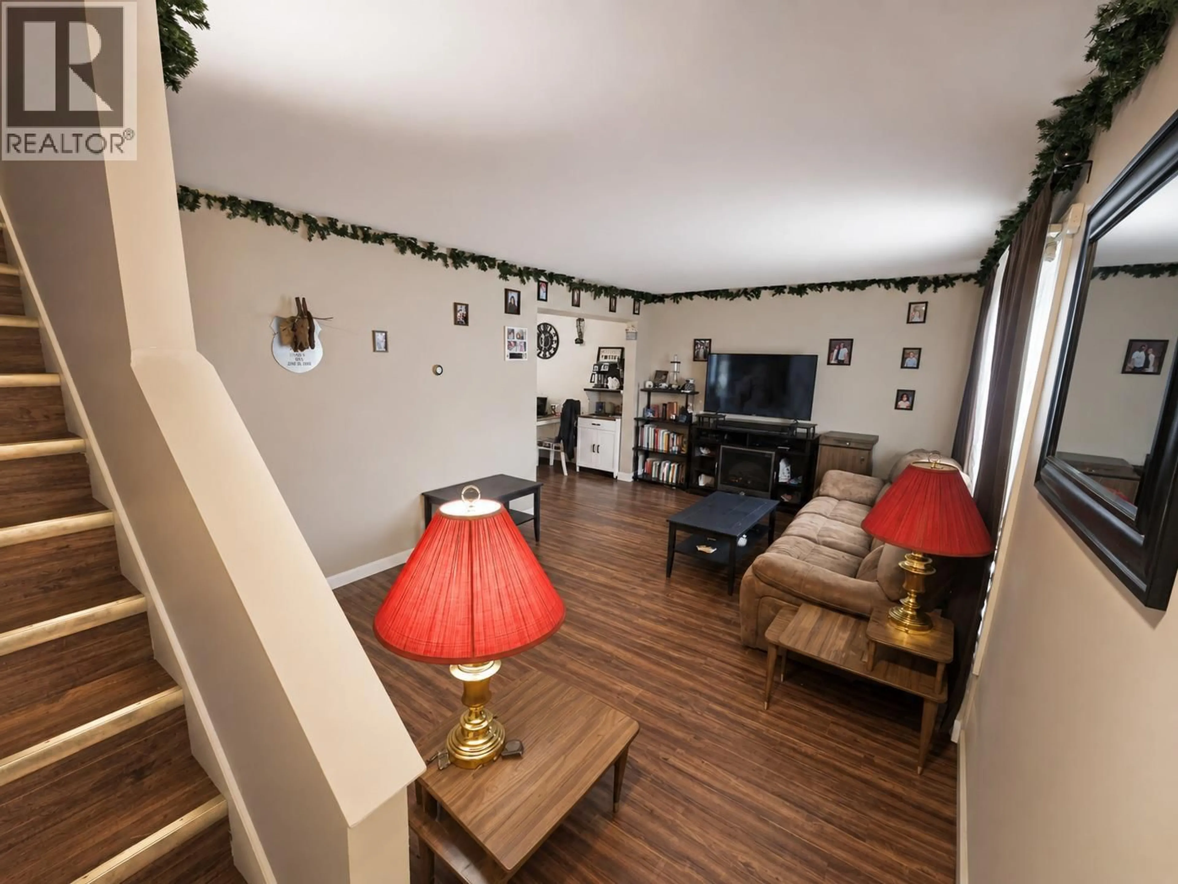 Living room with furniture, wood/laminate floor for 1710 110TH AVENUE, Dawson Creek British Columbia V1G2V4