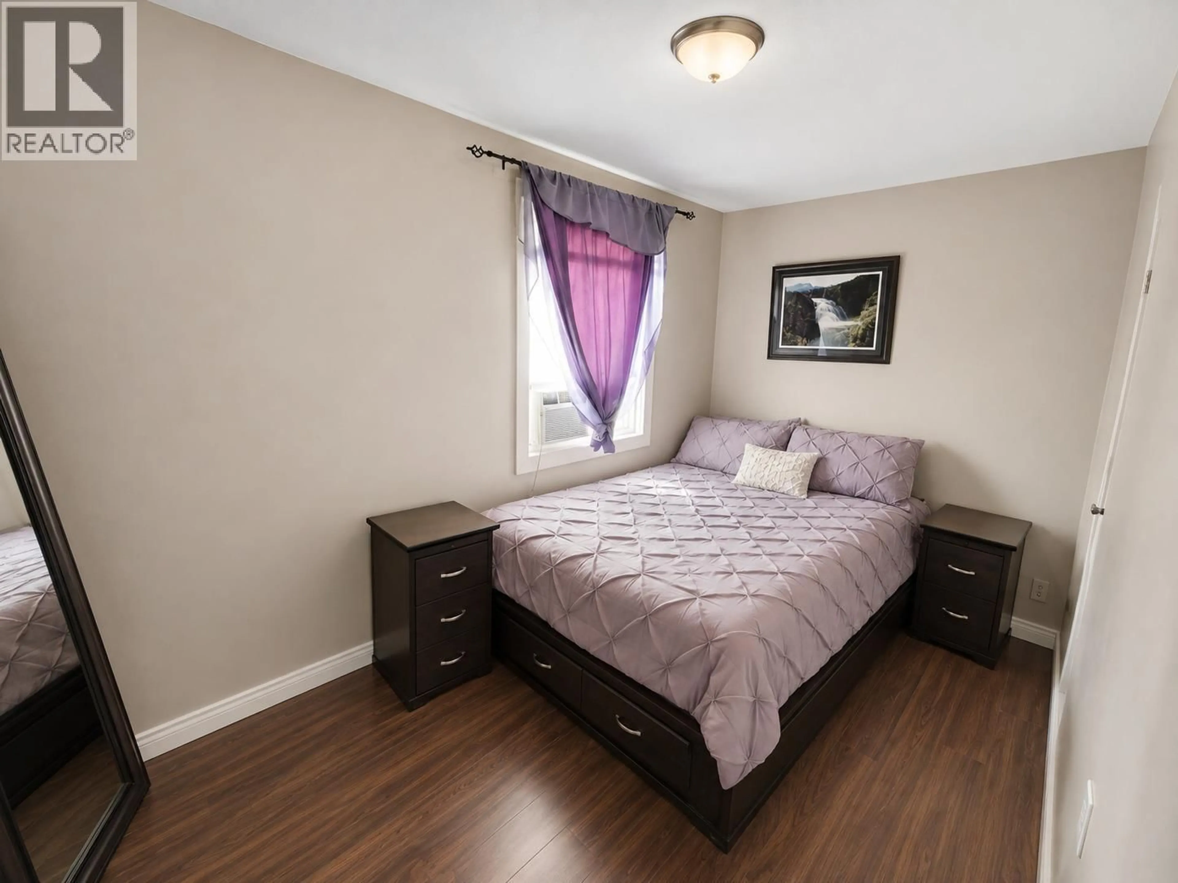 Bedroom with bed, wood/laminate floor for 1710 110TH AVENUE, Dawson Creek British Columbia V1G2V4