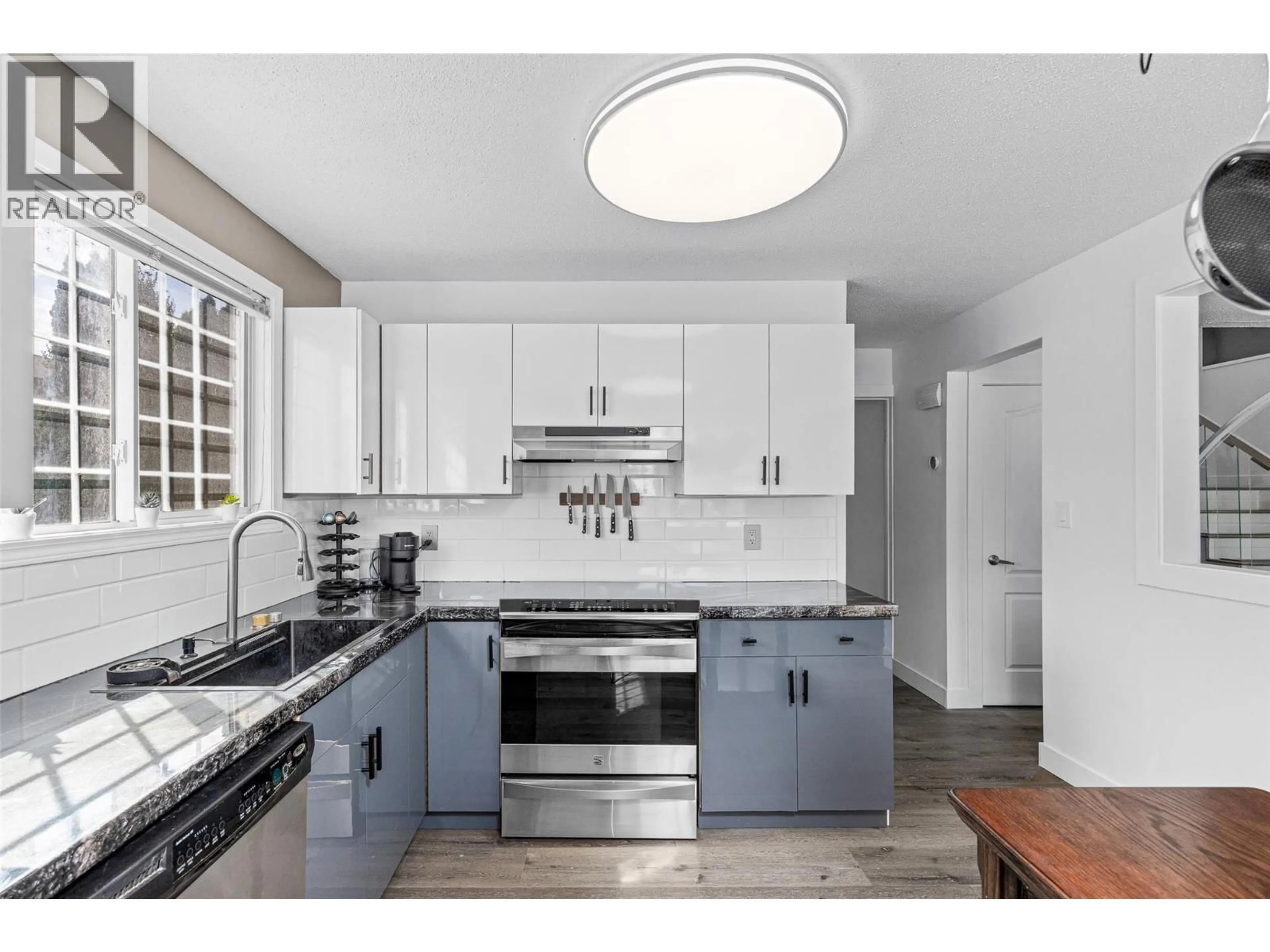 Open concept kitchen, ceramic/tile floor for 654 ARMOUR CRESCENT, Kelowna British Columbia V1W1A5
