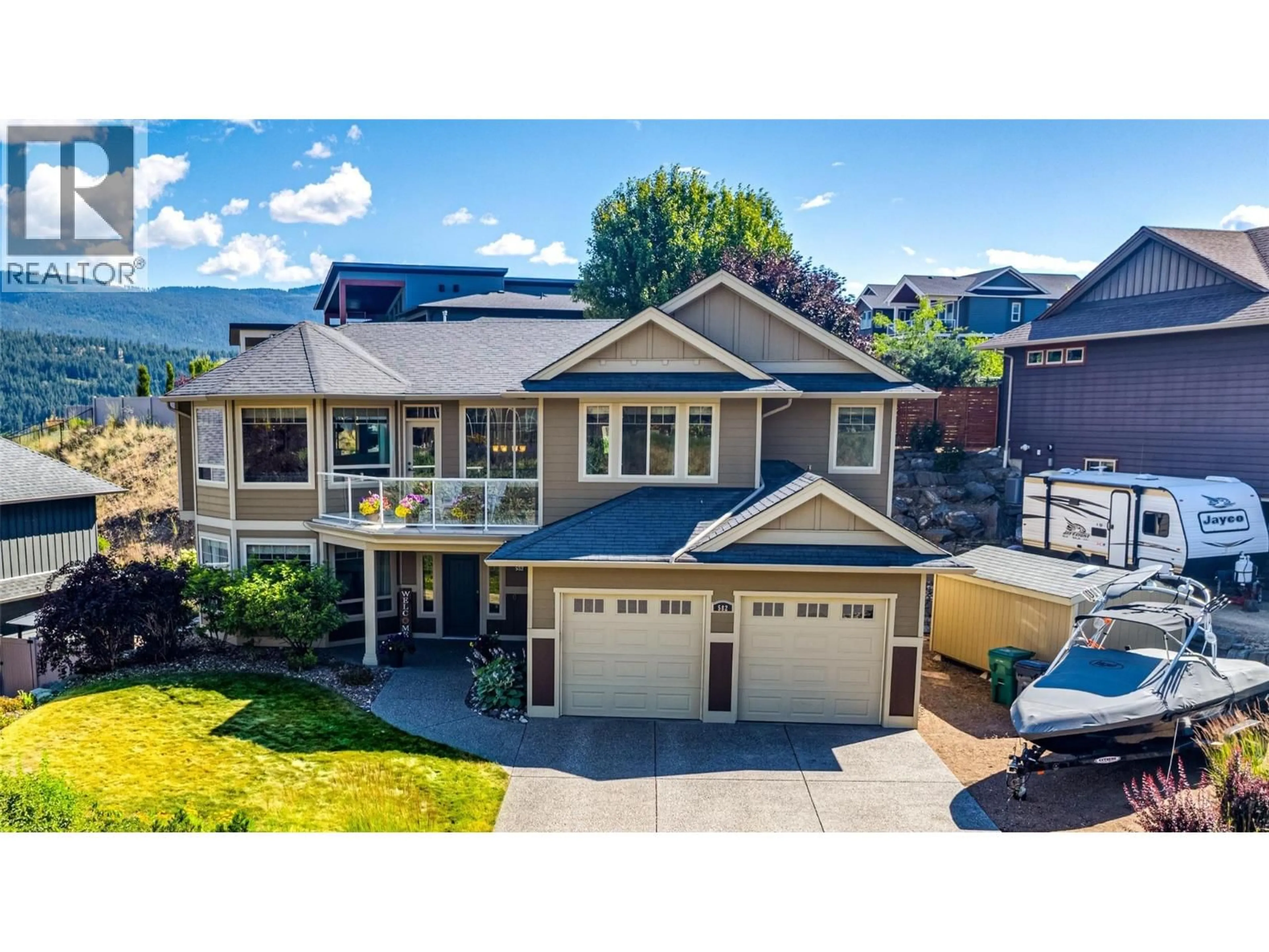 A pic from outside/outdoor area/front of a property/back of a property/a pic from drone, mountain view for 582 MT. IDA DRIVE, Coldstream British Columbia V1B4A8