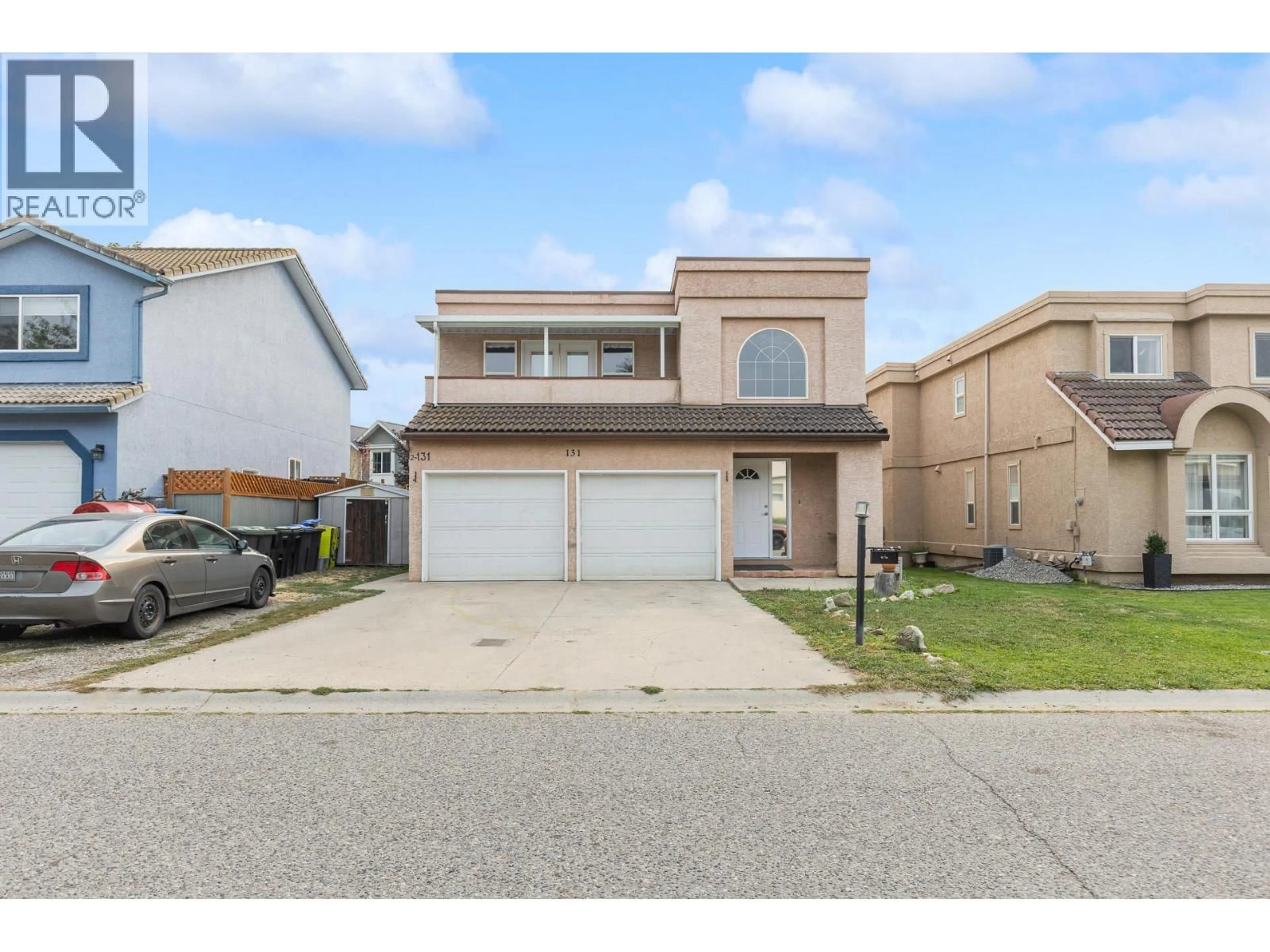 Home with vinyl exterior material, street for 131 CELANO CRESCENT, Kelowna British Columbia V1V1S9