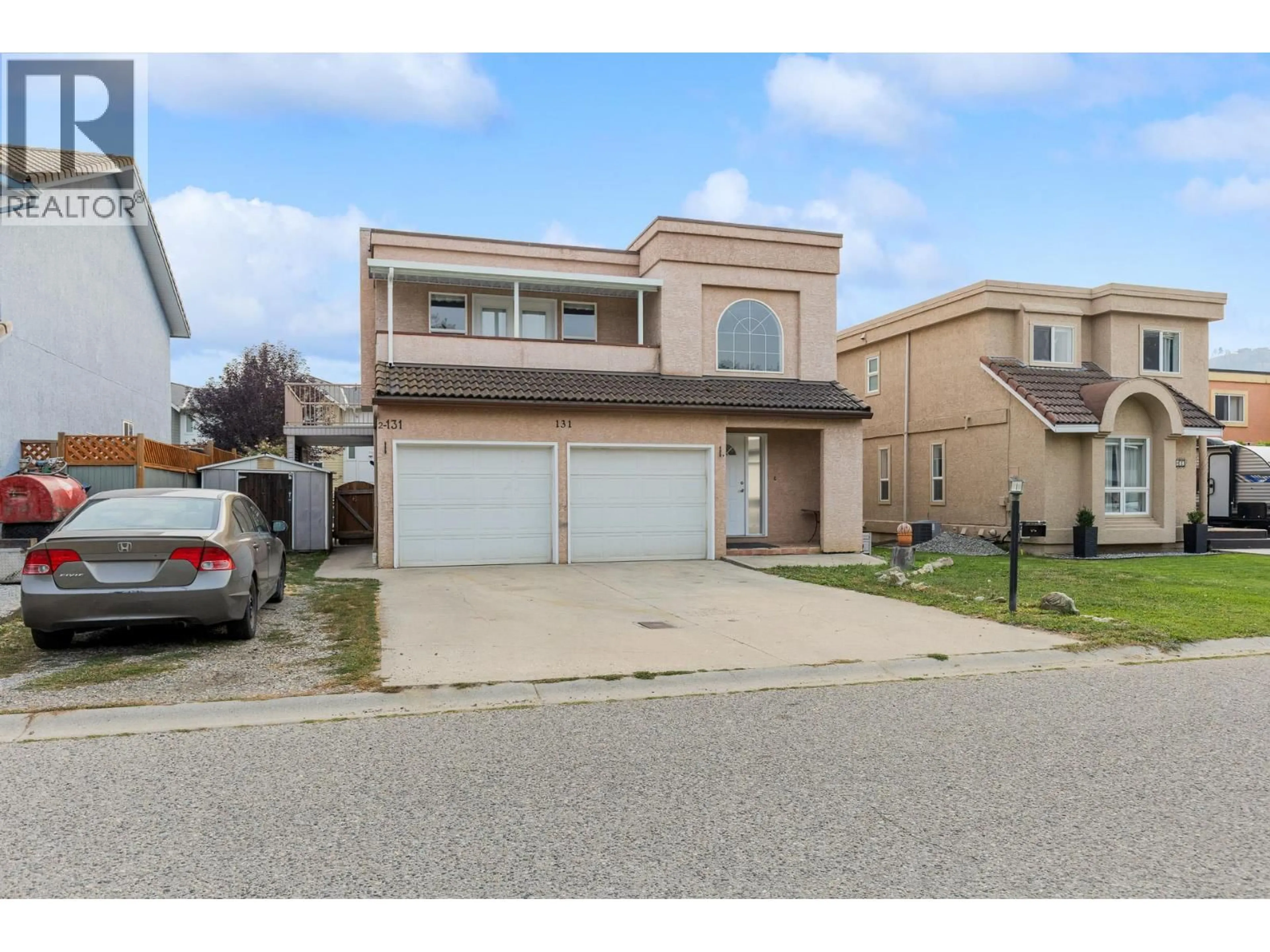 Home with vinyl exterior material, street for 131 CELANO CRESCENT, Kelowna British Columbia V1V1S9