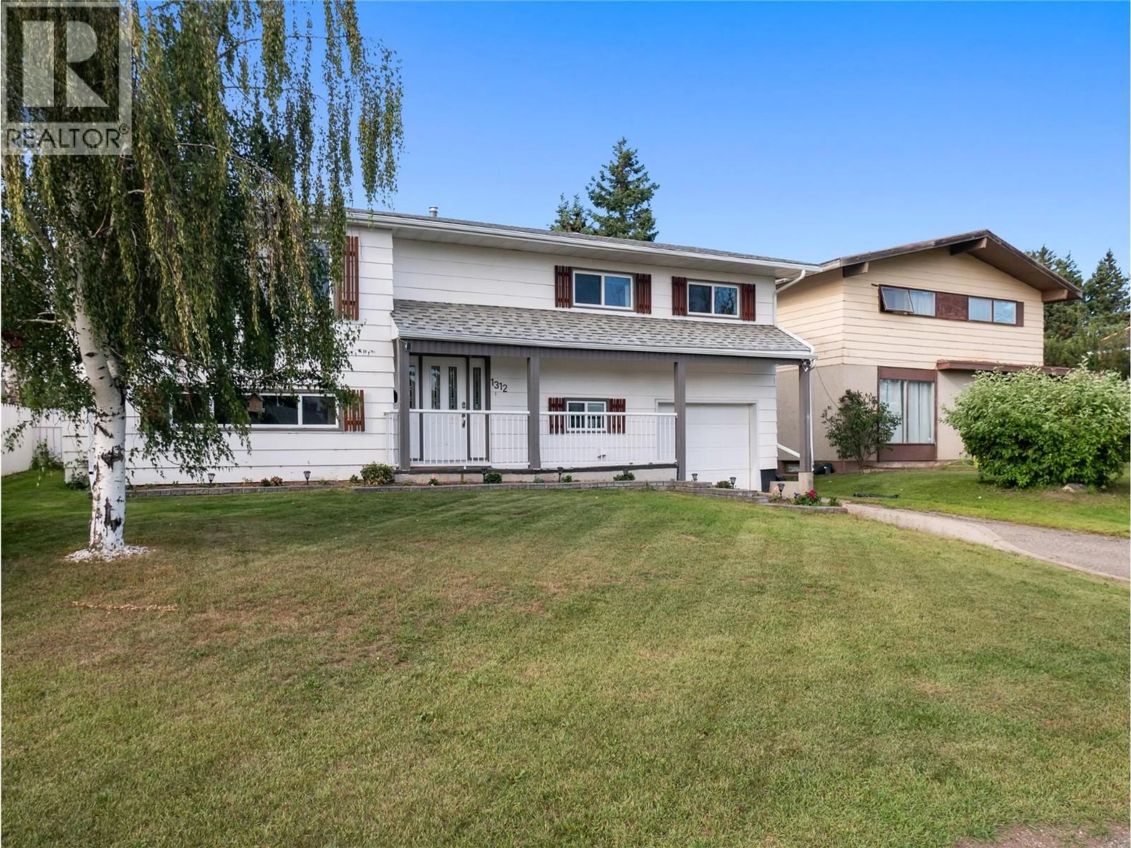 Home with vinyl exterior material, street for 1312 92 AVENUE, Dawson Creek British Columbia V1G1C3