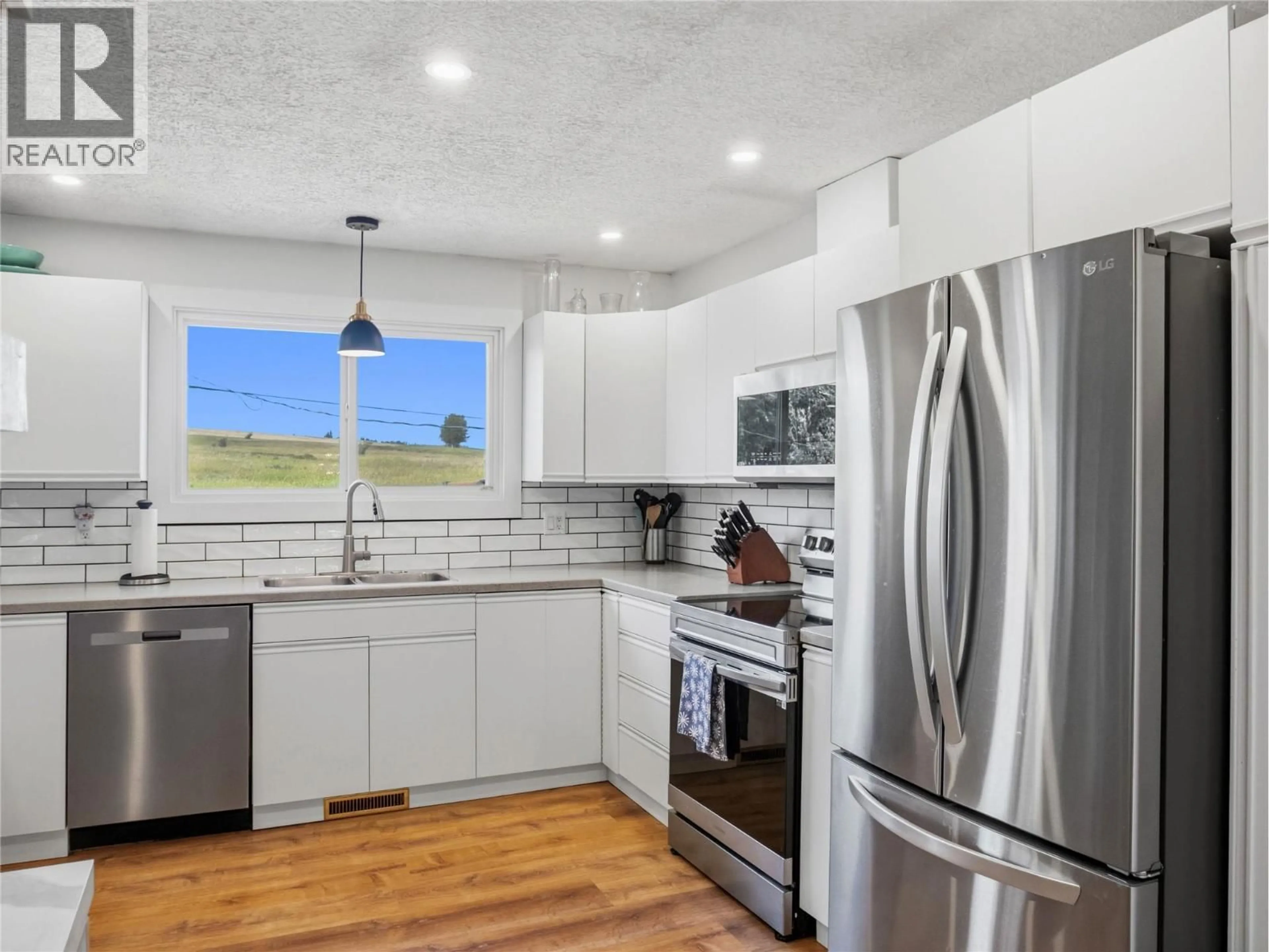Open concept kitchen, unknown for 1312 92 AVENUE, Dawson Creek British Columbia V1G1C3