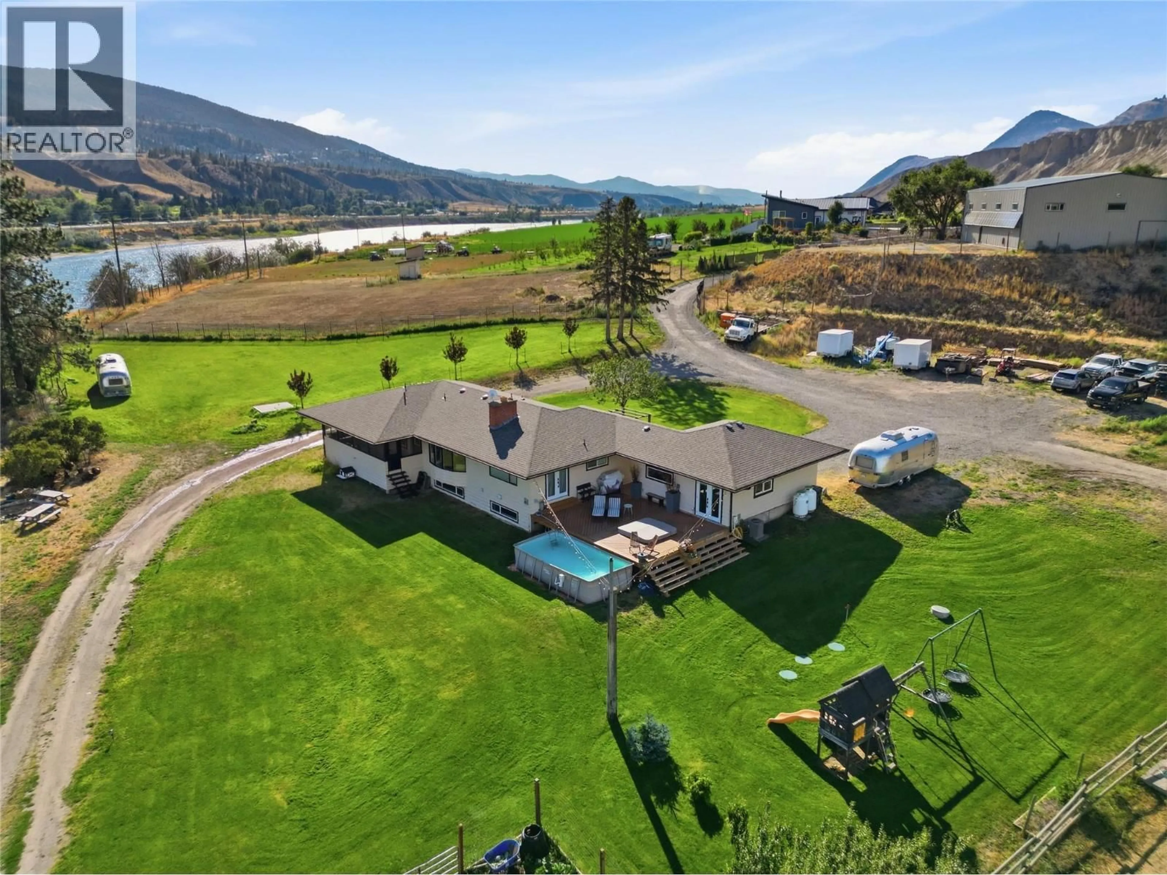 A pic from outside/outdoor area/front of a property/back of a property/a pic from drone, water/lake/river/ocean view for SHUSWAP ROAD EAST, Kamloops British Columbia V2H1S9