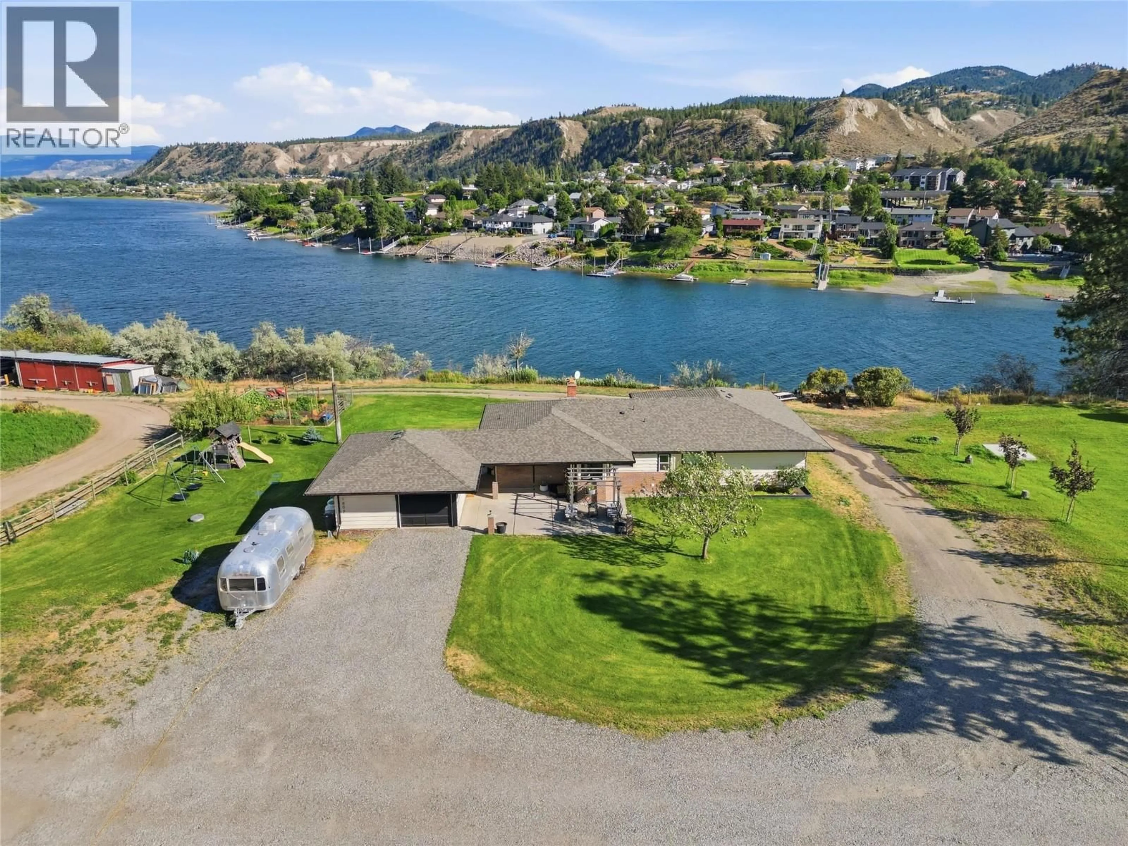 A pic from outside/outdoor area/front of a property/back of a property/a pic from drone, water/lake/river/ocean view for SHUSWAP ROAD EAST, Kamloops British Columbia V2H1S9