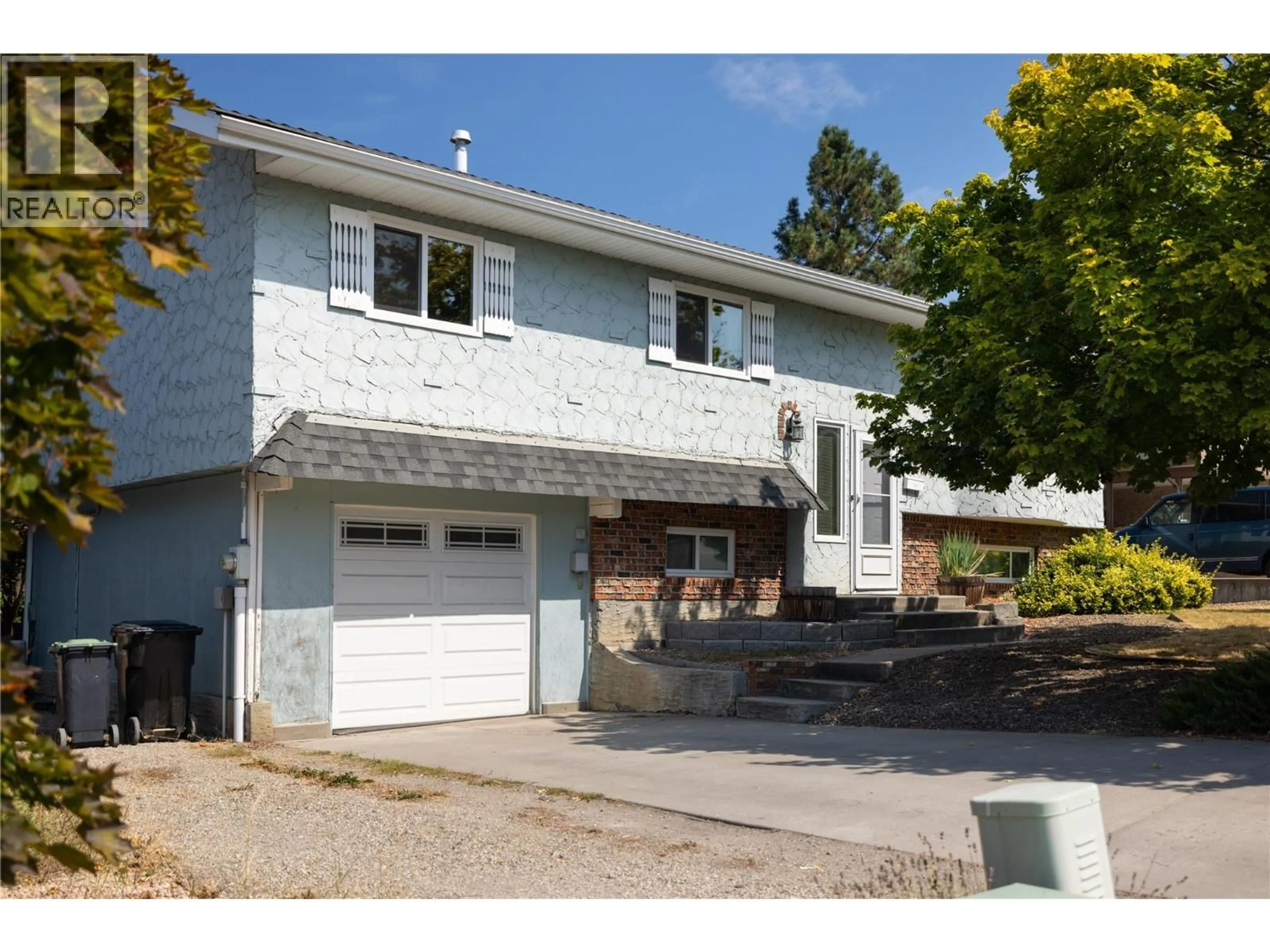 Home with vinyl exterior material, street for 1205 43 AVENUE, Vernon British Columbia V1T8J9