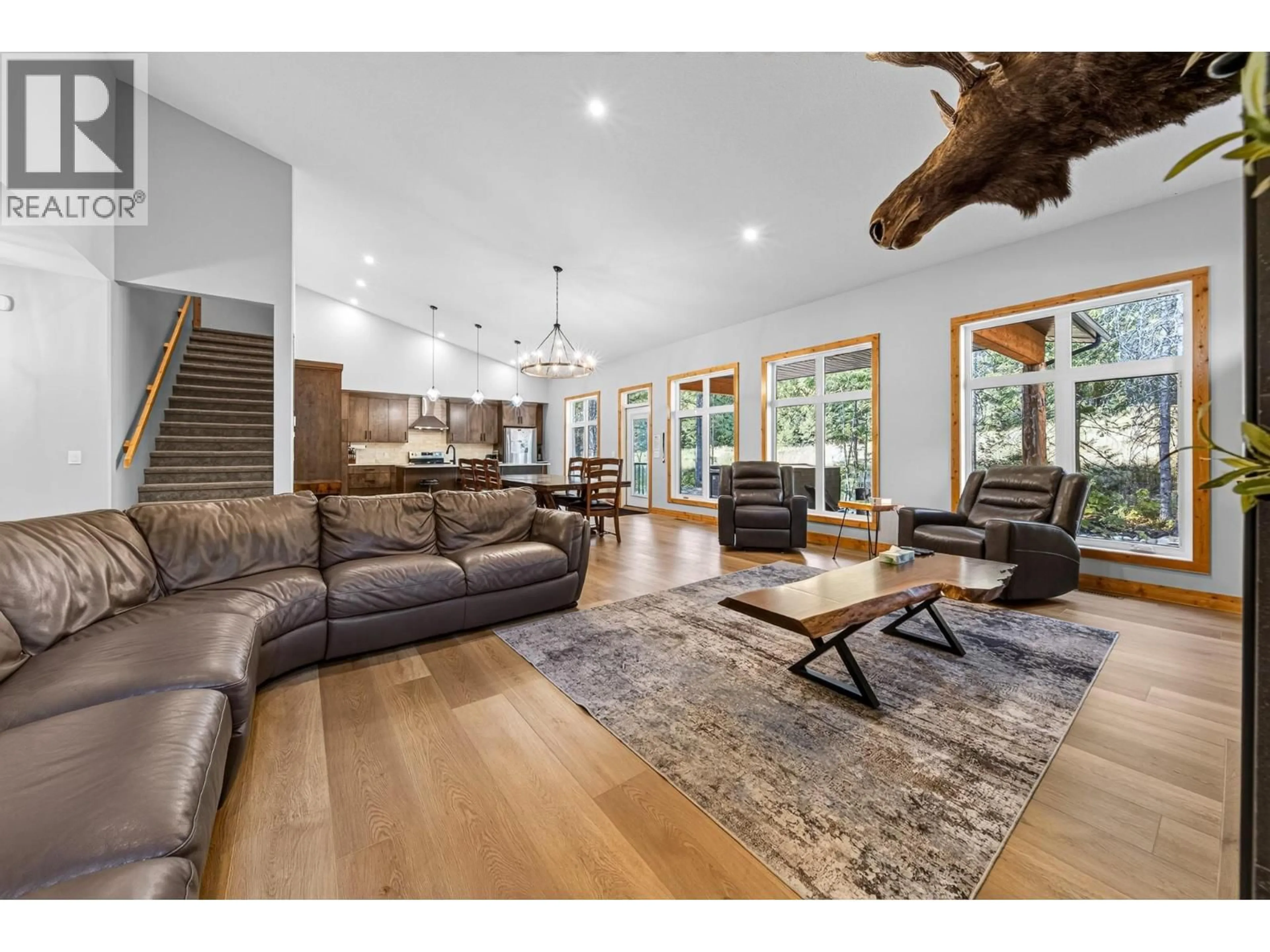 Living room with furniture, wood/laminate floor for 5550 CURRIE BOWL WAY, Fernie British Columbia V0B1M6