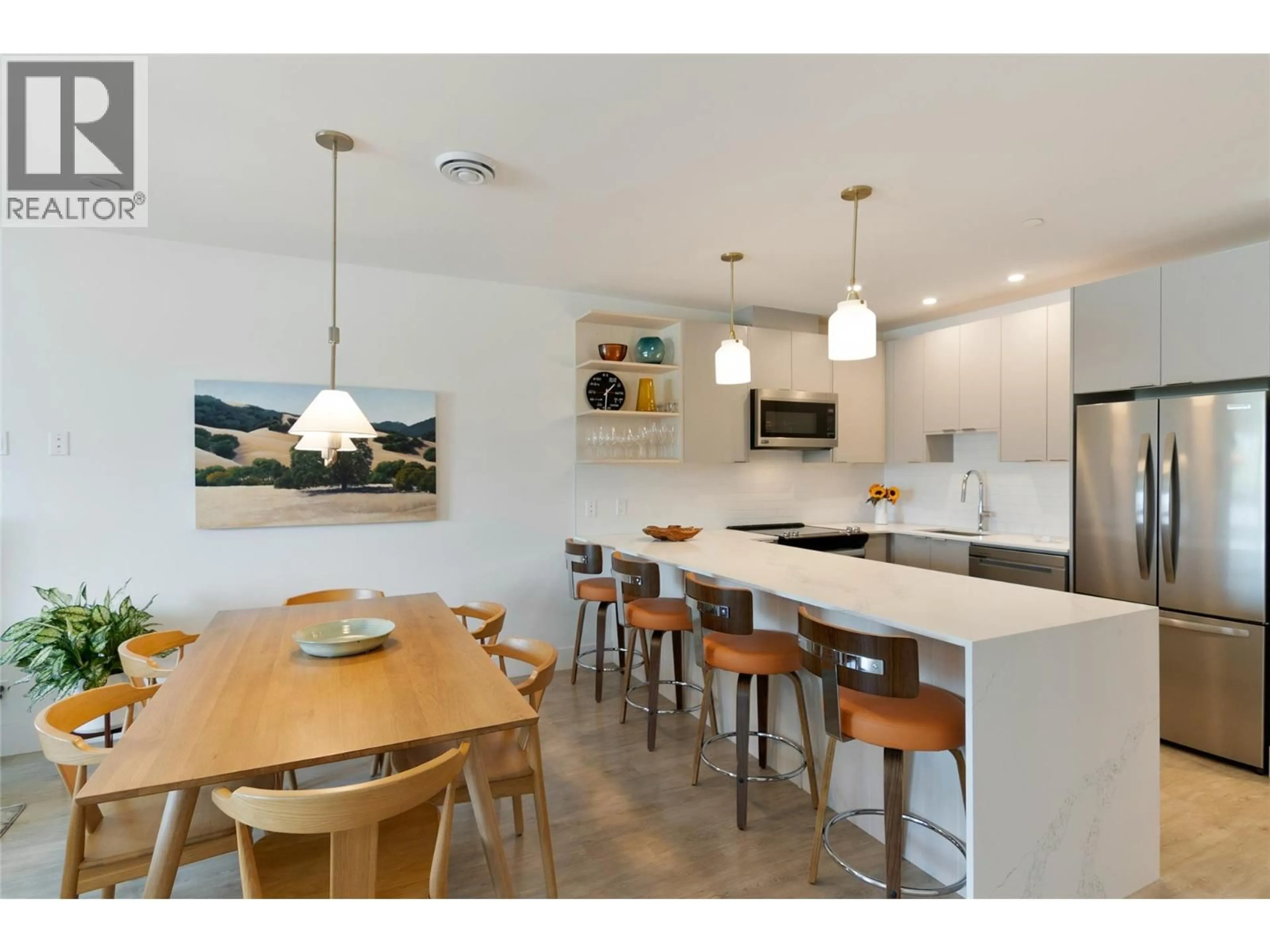 Open concept kitchen, wood/laminate floor for 3312 - 1701 COURSIER AVENUE, Revelstoke British Columbia V0E2S0
