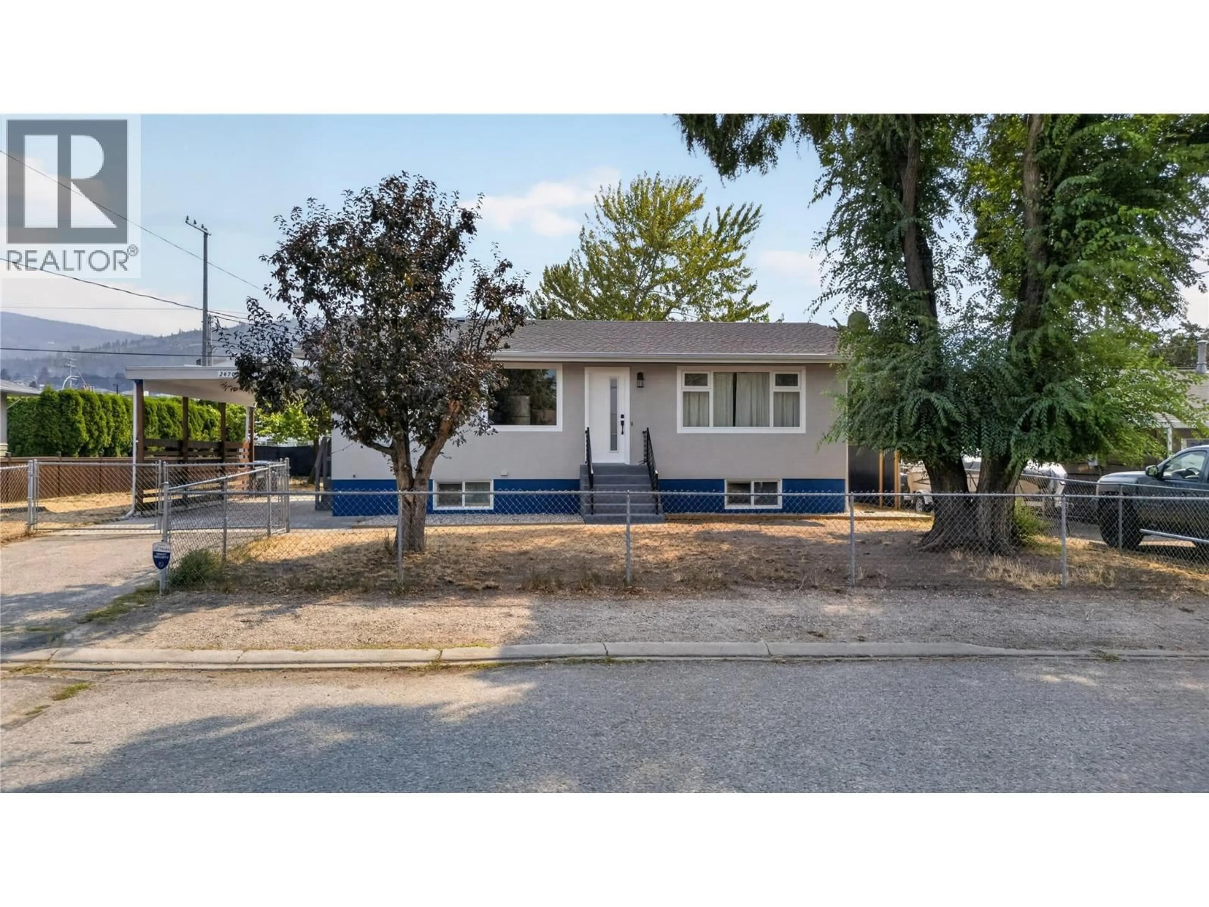 Home with vinyl exterior material, street for 2470 MCKENZIE STREET, Penticton British Columbia V2A6H7