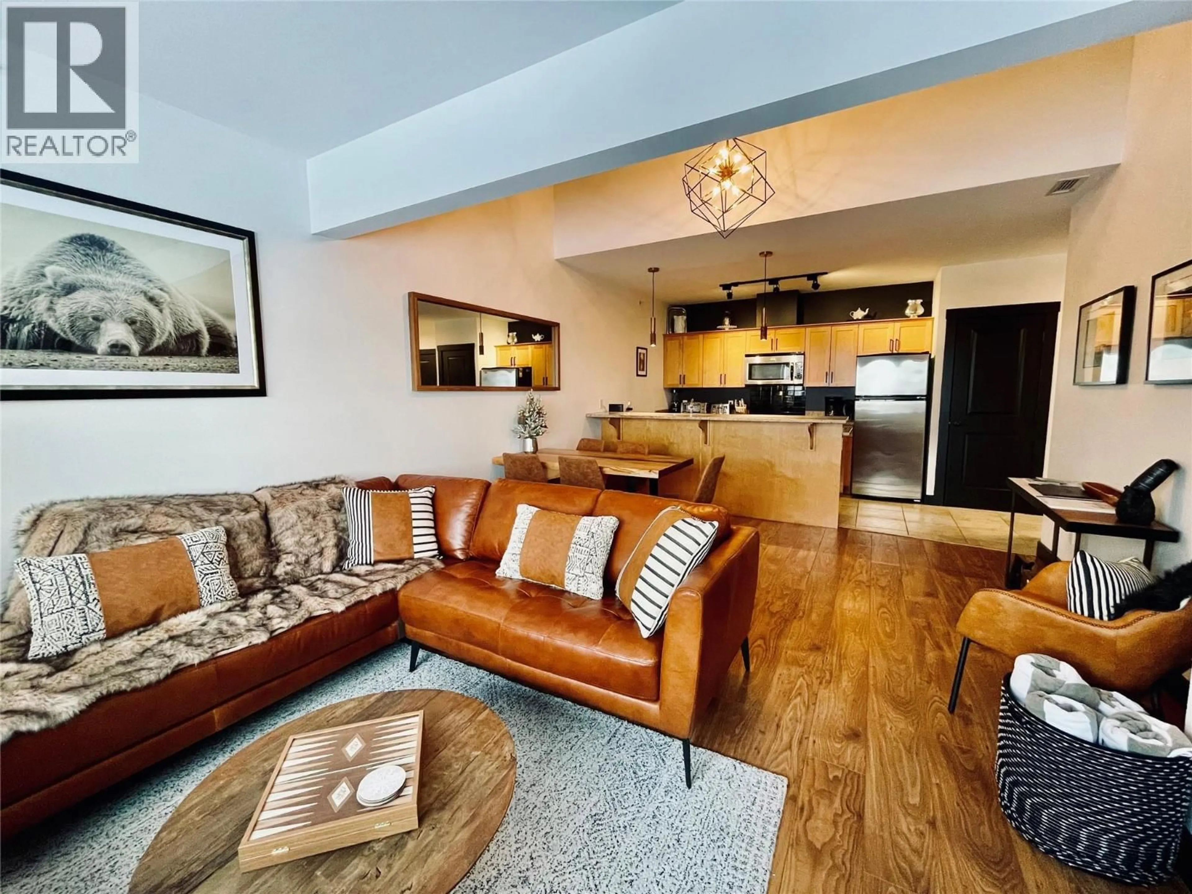 Living room with furniture, wood/laminate floor for 403 - 1420 PALLISER TRAIL, Golden British Columbia V0A1H0