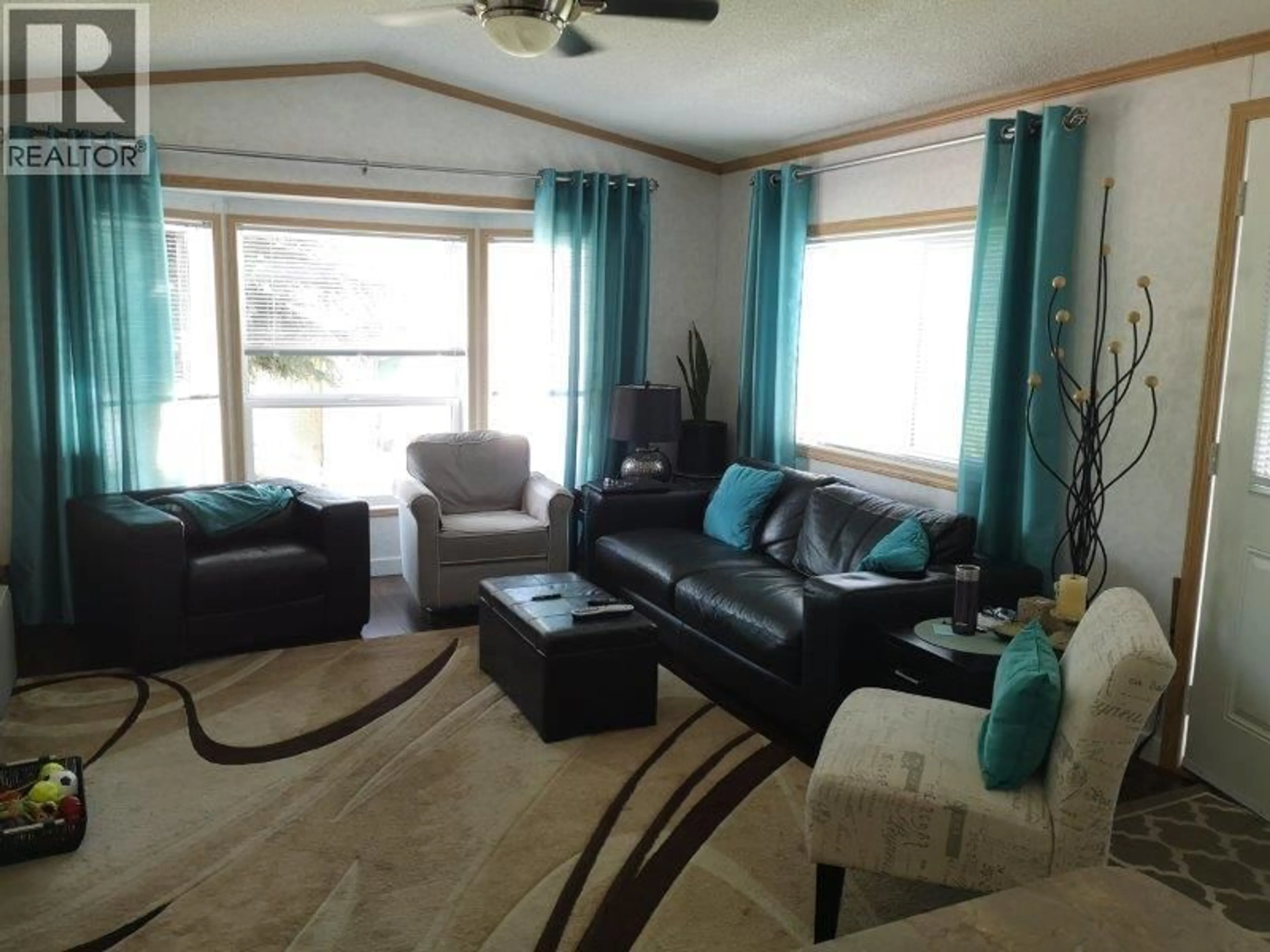 Living room with furniture, wood/laminate floor for 28 - 1250 HILLSIDE AVENUE, Chase British Columbia V0E1M0