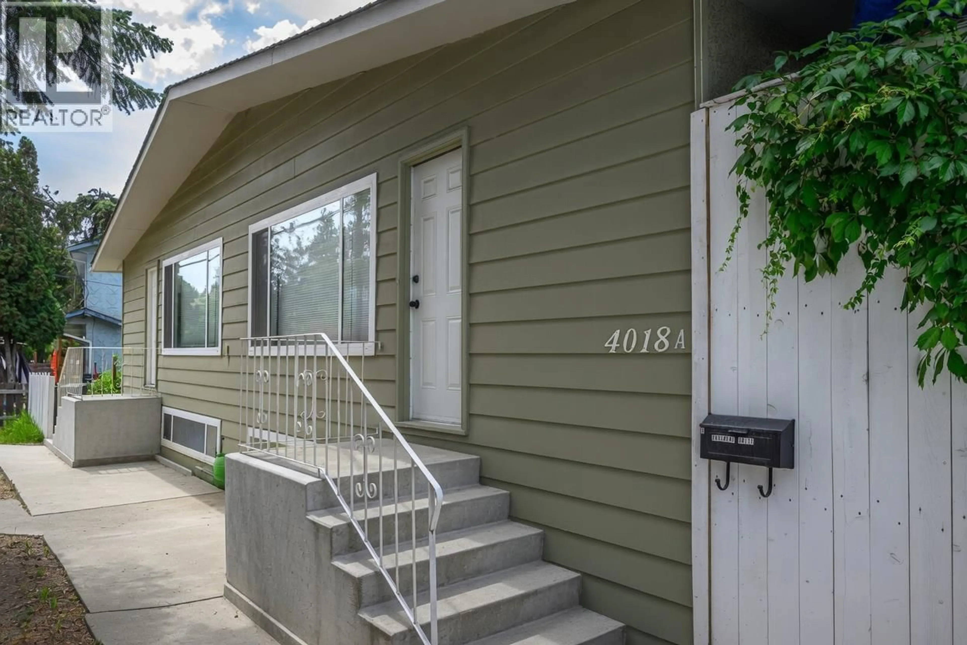 Home with vinyl exterior material, street for 4018 PLEASANT VALLEY ROAD, Vernon British Columbia V1T4M2