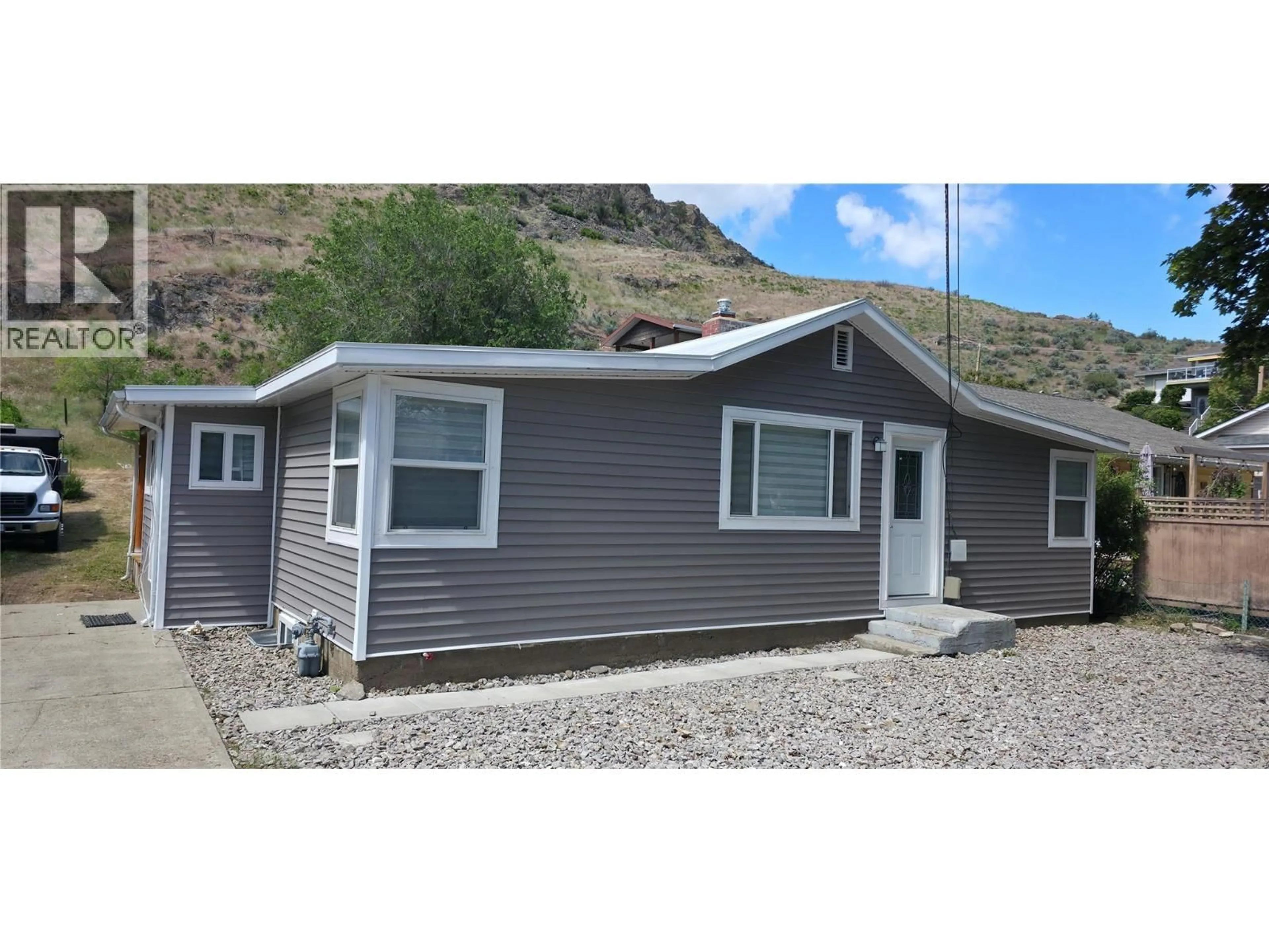 Home with vinyl exterior material, street for 6176 SPARTAN STREET, Oliver British Columbia V0H1T6