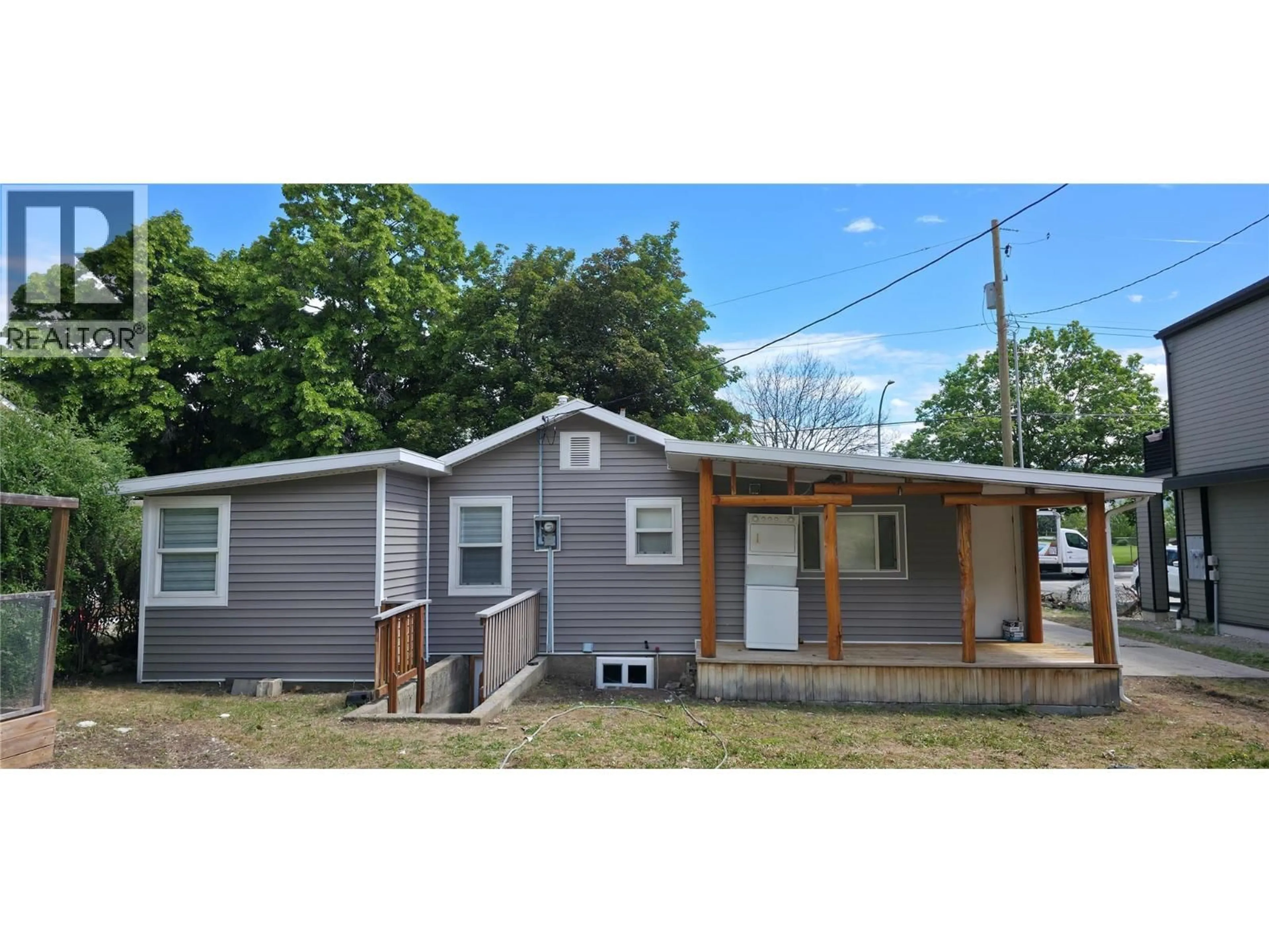 Home with vinyl exterior material, street for 6176 SPARTAN STREET, Oliver British Columbia V0H1T6
