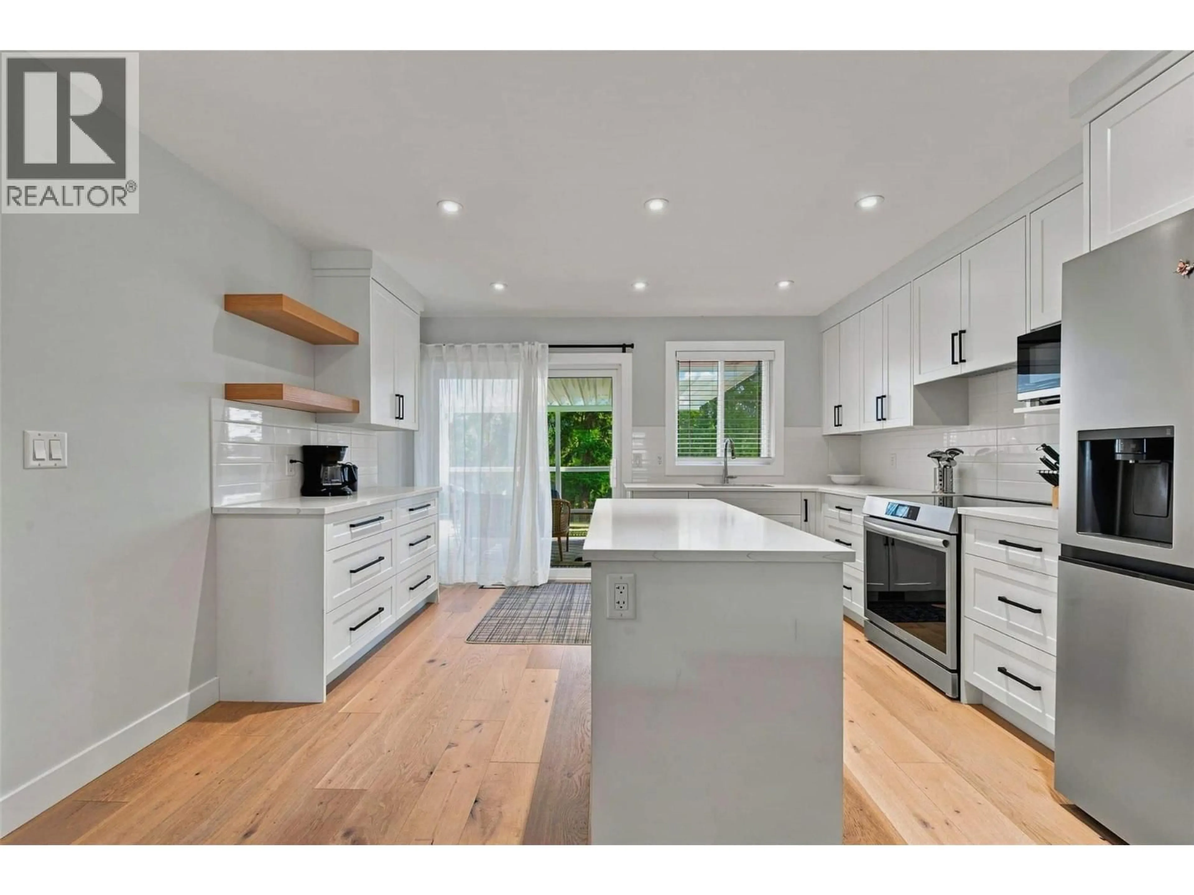 Open concept kitchen, wood/laminate floor for 3173 COVENTRY CRESCENT, West Kelowna British Columbia V4T1E8