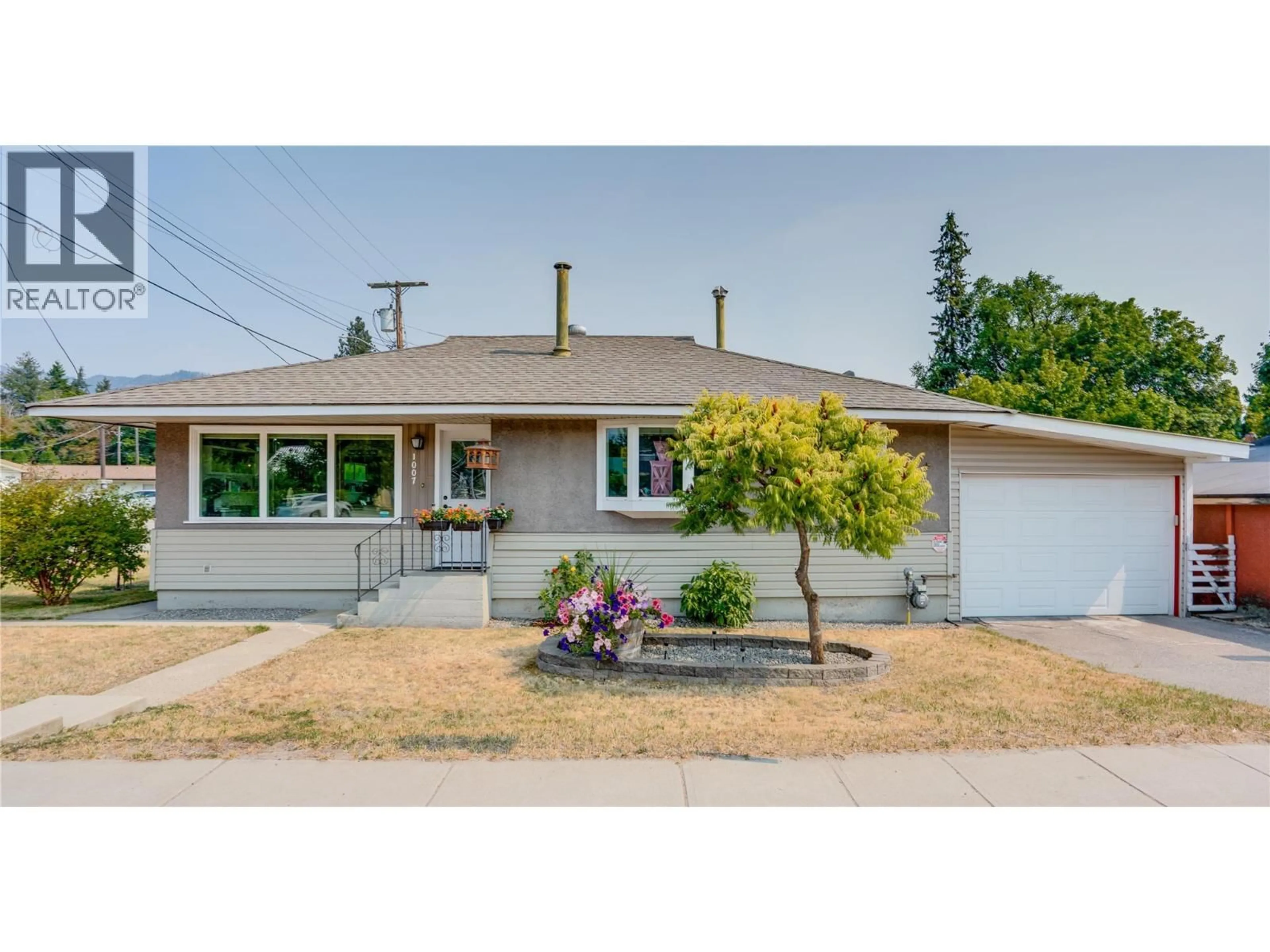 Home with vinyl exterior material, street for 1007 GEORGE STREET, Enderby British Columbia V0E1V0