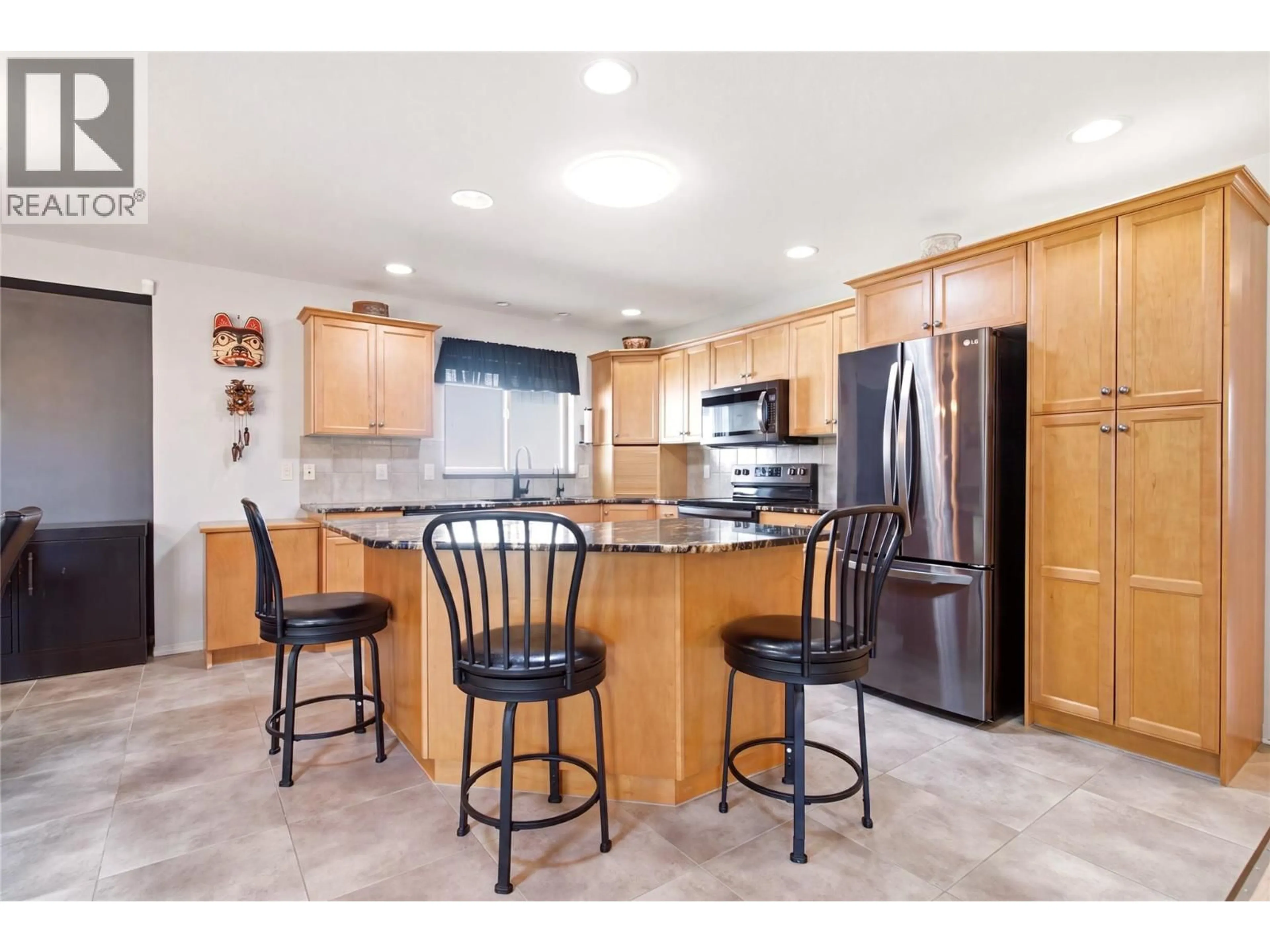 Open concept kitchen, ceramic/tile floor for 58 - 2365 STILLINGFLEET ROAD, Kelowna British Columbia V1W4X5