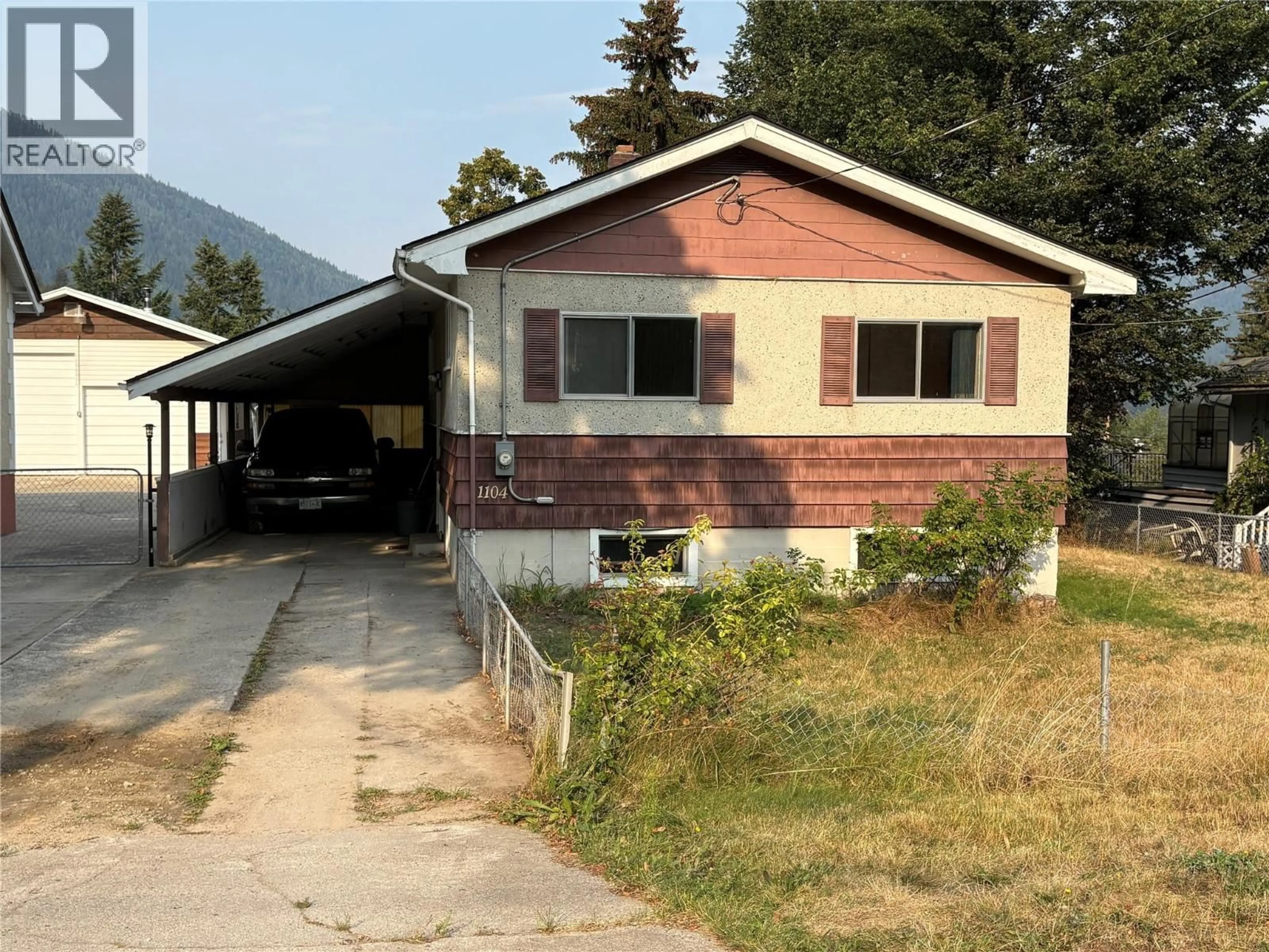 Home with vinyl exterior material, mountain view for 1104 MCQUARRIE AVENUE, Nelson British Columbia V1L1B2