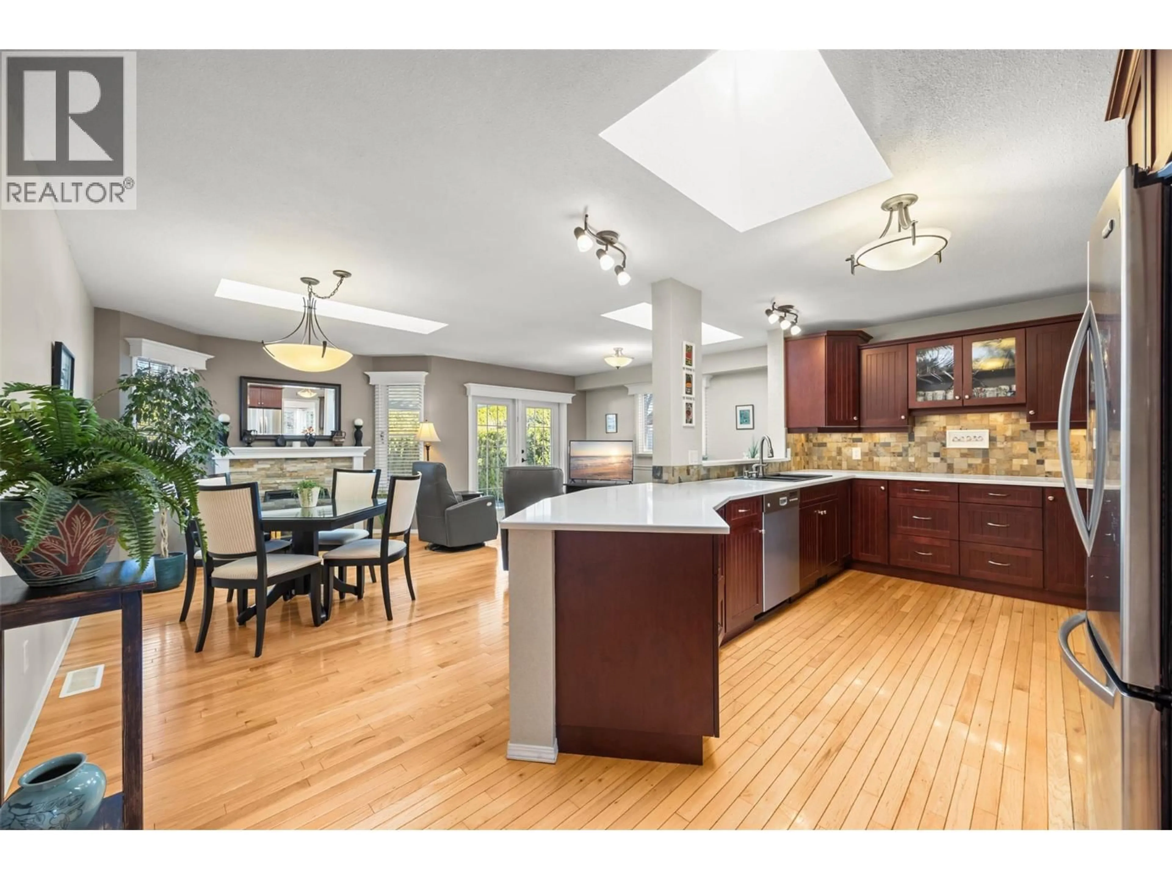Open concept kitchen, wood/laminate floor for 1384 NELSON PLACE, Kelowna British Columbia V1Y9H4