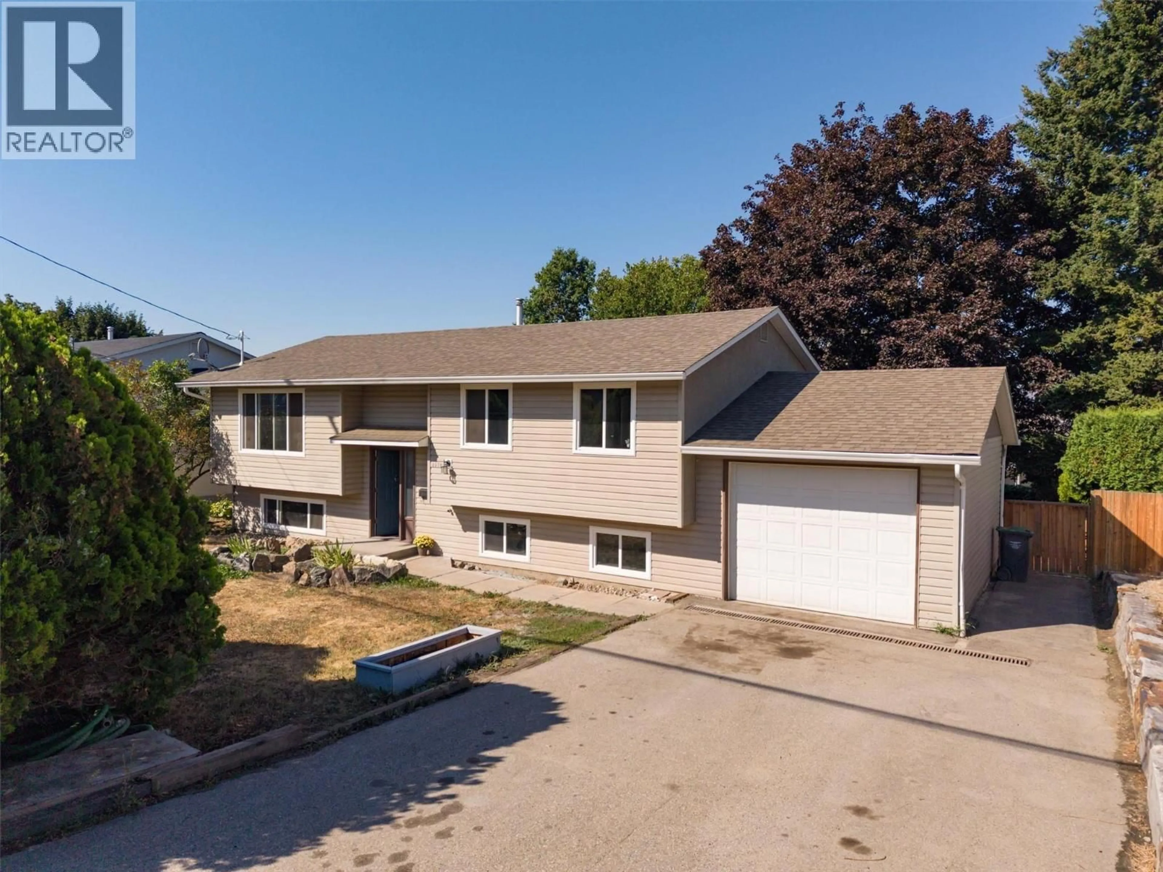 A pic from outside/outdoor area/front of a property/back of a property/a pic from drone, street for 3570 WESTON ROAD, Kelowna British Columbia V1X6K2