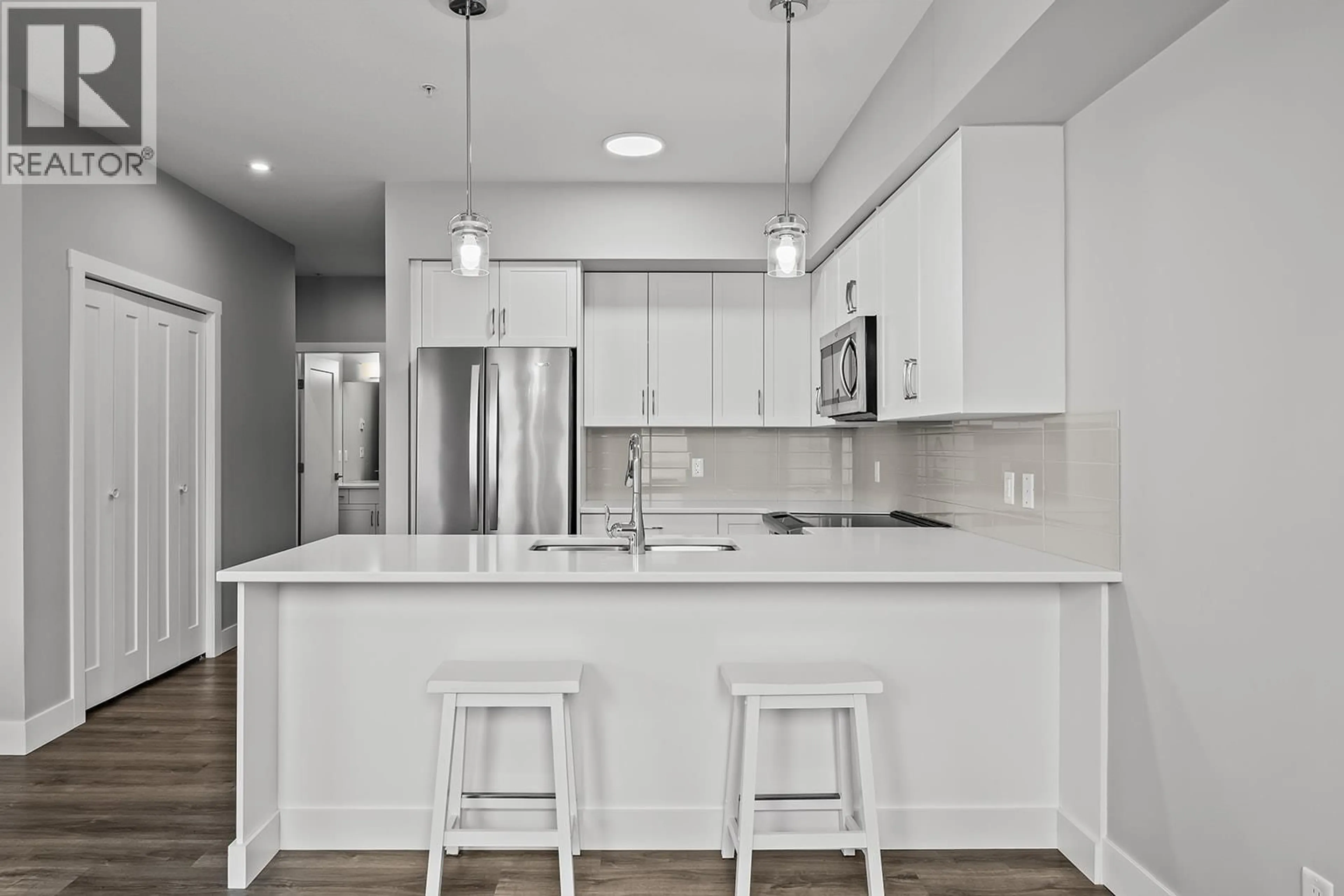 Open concept kitchen, ceramic/tile floor for 102 - 3090 BURTCH ROAD, Kelowna British Columbia V1W5G9