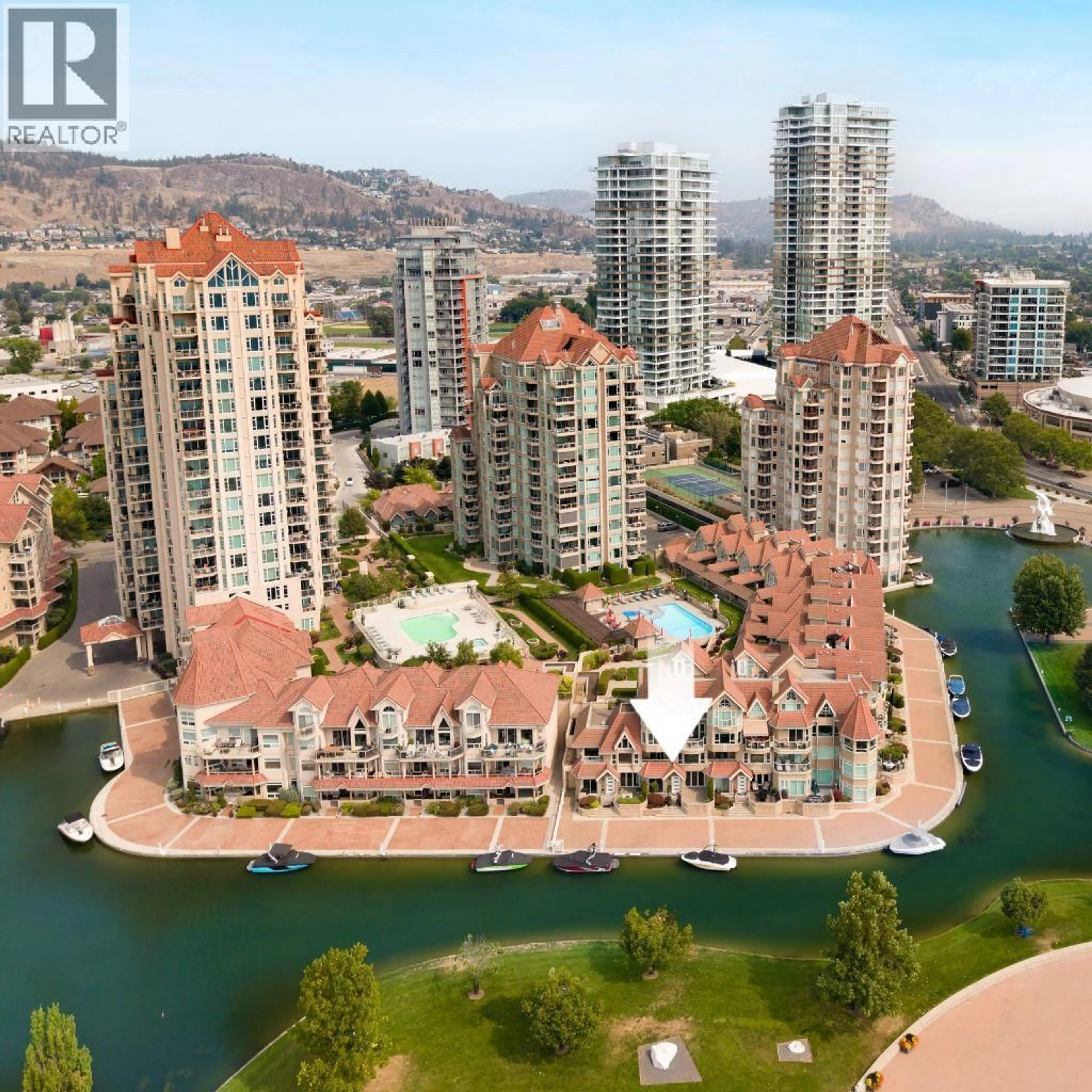 A pic from outside/outdoor area/front of a property/back of a property/a pic from drone, water/lake/river/ocean view for 123 - 1156 SUNSET DRIVE, Kelowna British Columbia V1Y9R7