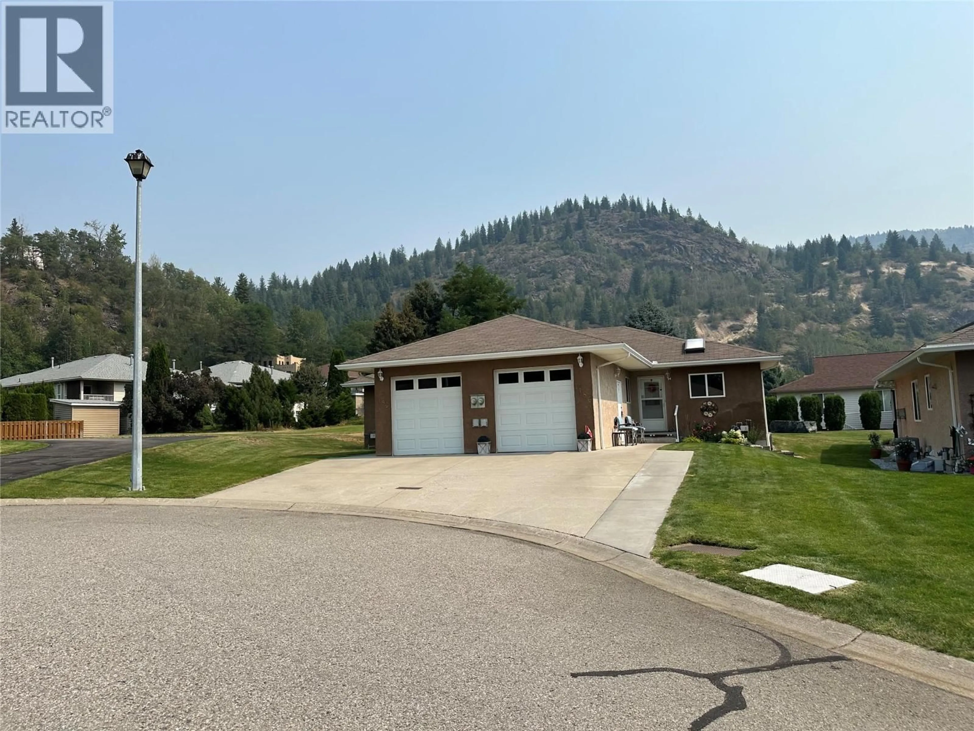 A pic from outside/outdoor area/front of a property/back of a property/a pic from drone, mountain view for 7186 WRIGHT WAY, Trail British Columbia V1R4X6