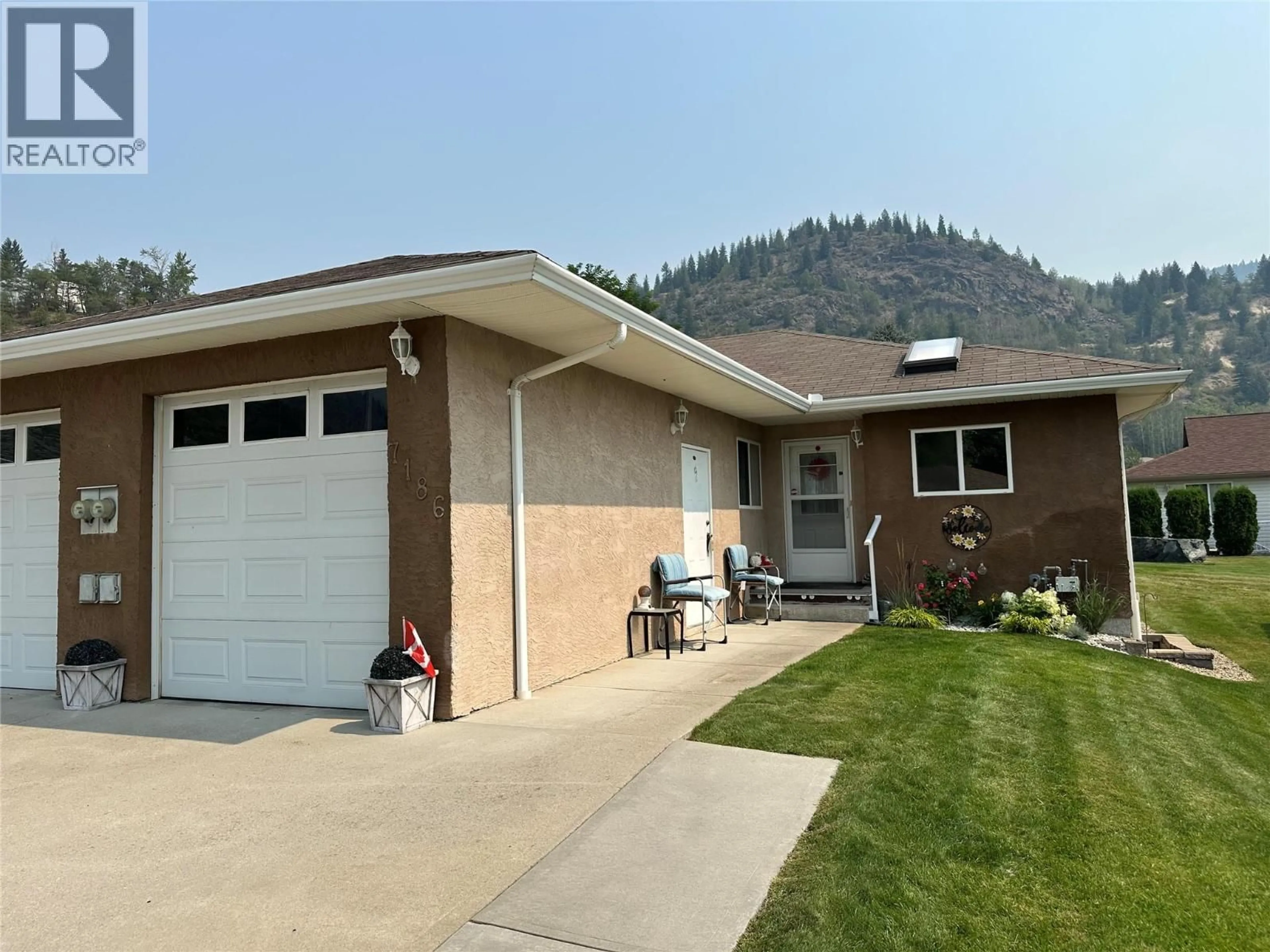 Home with vinyl exterior material, mountain view for 7186 WRIGHT WAY, Trail British Columbia V1R4X6