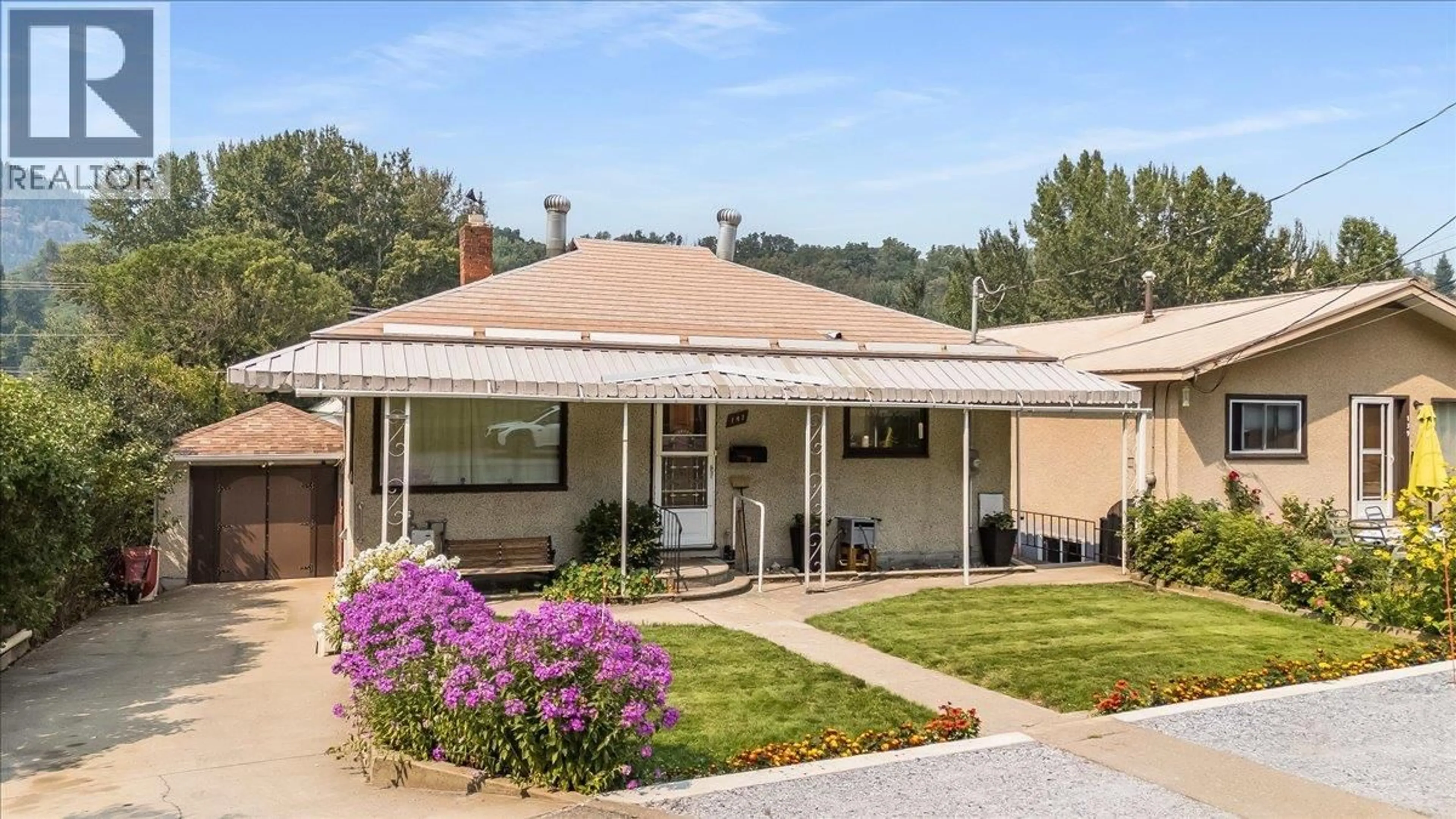 Home with vinyl exterior material, mountain view for 141 COLLEY STREET, Warfield British Columbia V1R2M3