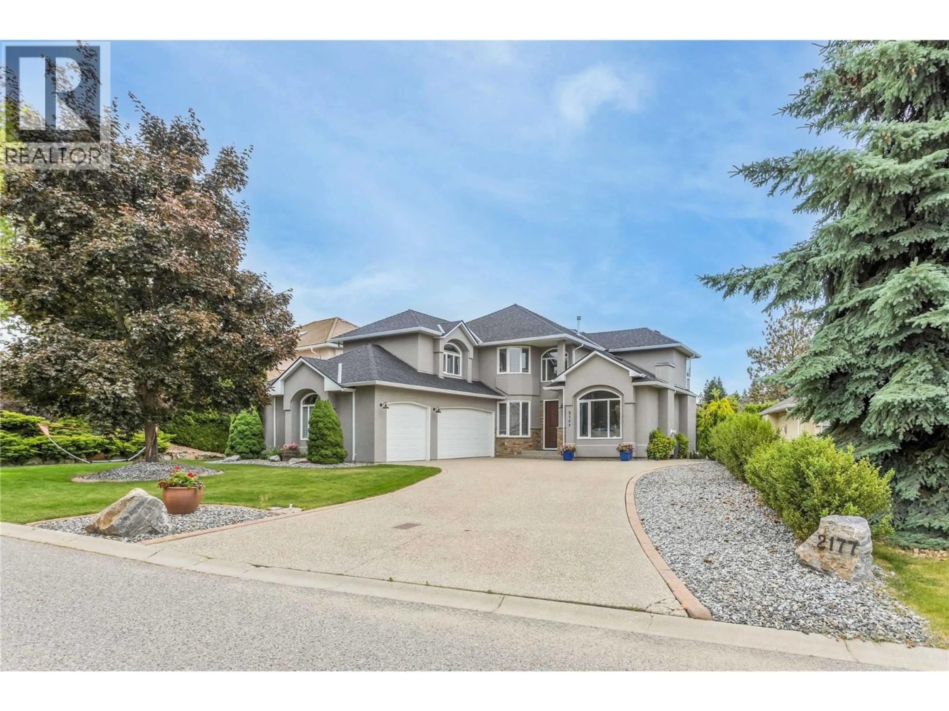 Home with vinyl exterior material, street for 2177 BRECKENRIDGE COURT, Kelowna British Columbia V1V1W2