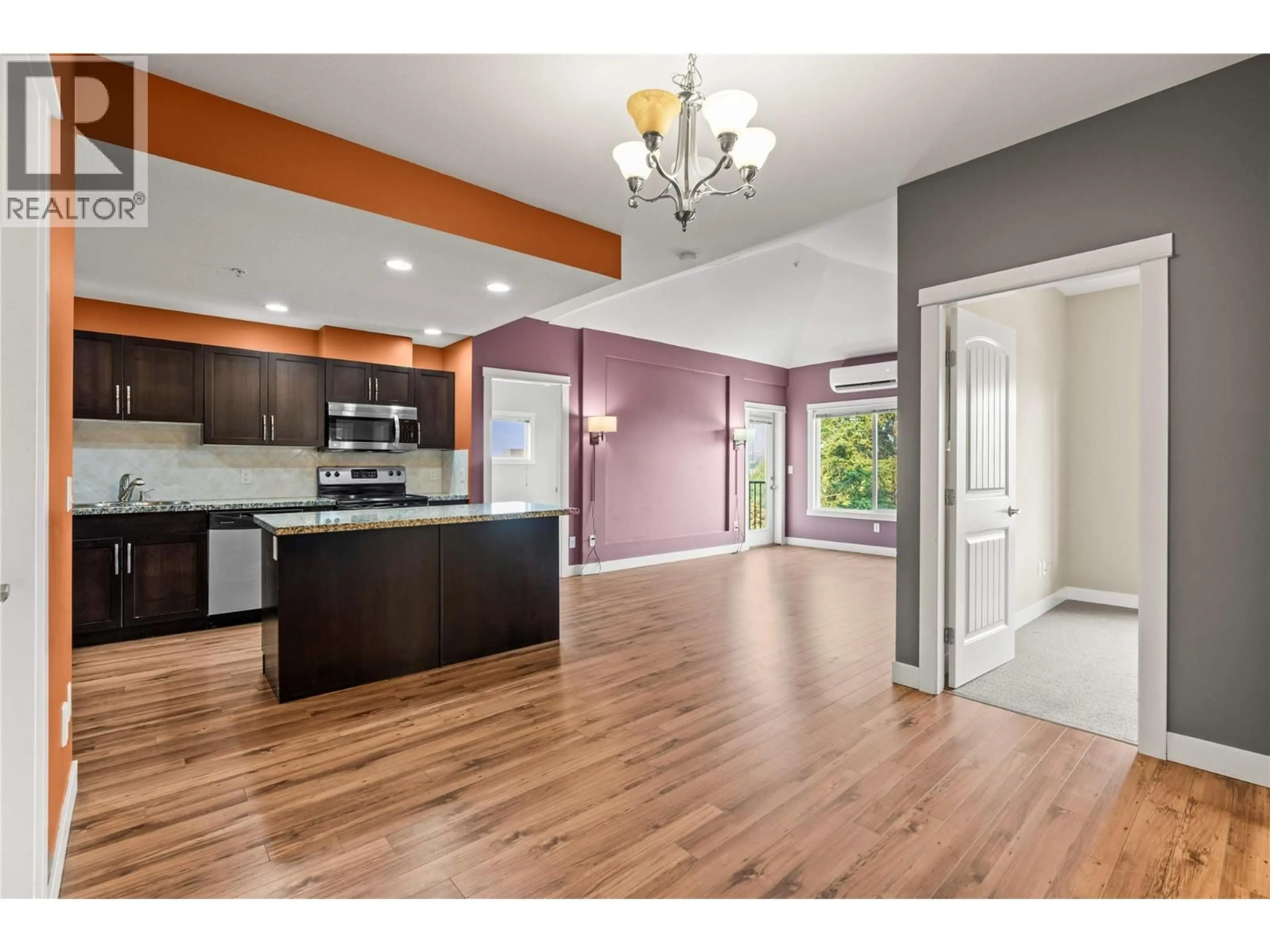 Open concept kitchen, wood/laminate floor for 24 - 3211 CENTENNIAL DRIVE, Vernon British Columbia V1T2T8