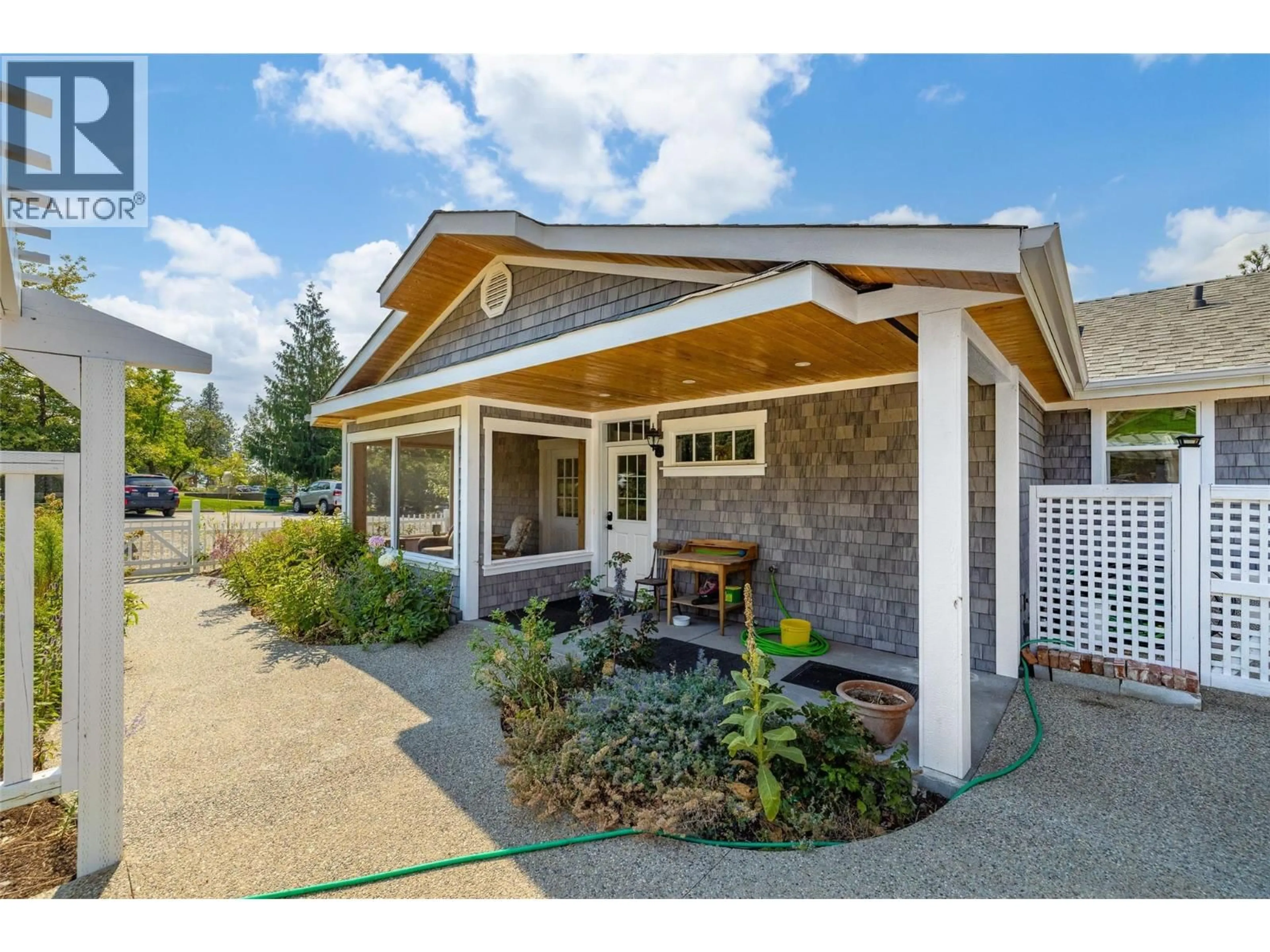 Home with vinyl exterior material, street for 11311 OKANAGAN CENTRE ROAD WEST, Lake Country British Columbia V4V2J6