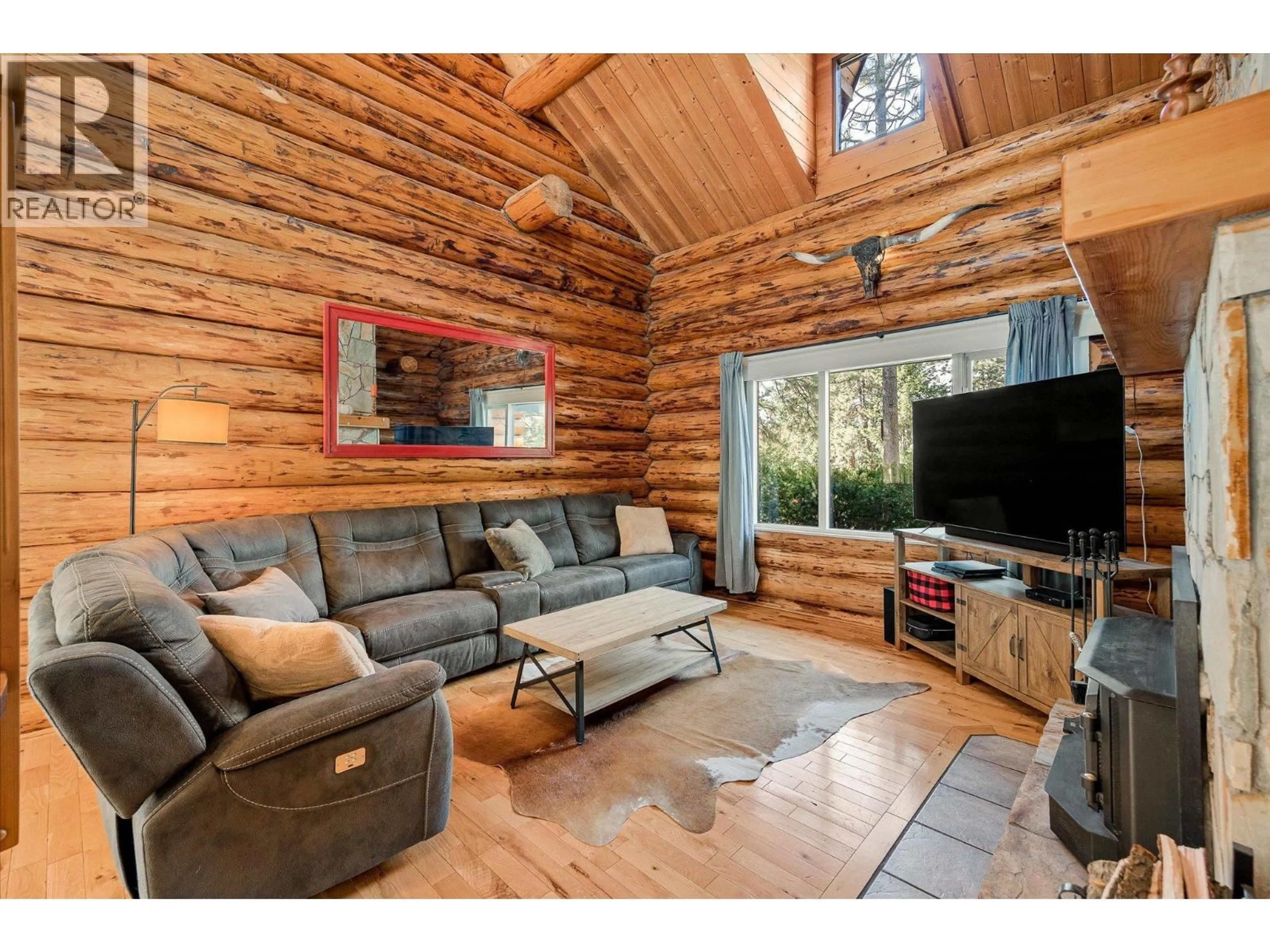 Living room with furniture, wood/laminate floor for 1725 KELOKA DRIVE, West Kelowna British Columbia V1Z2Y3