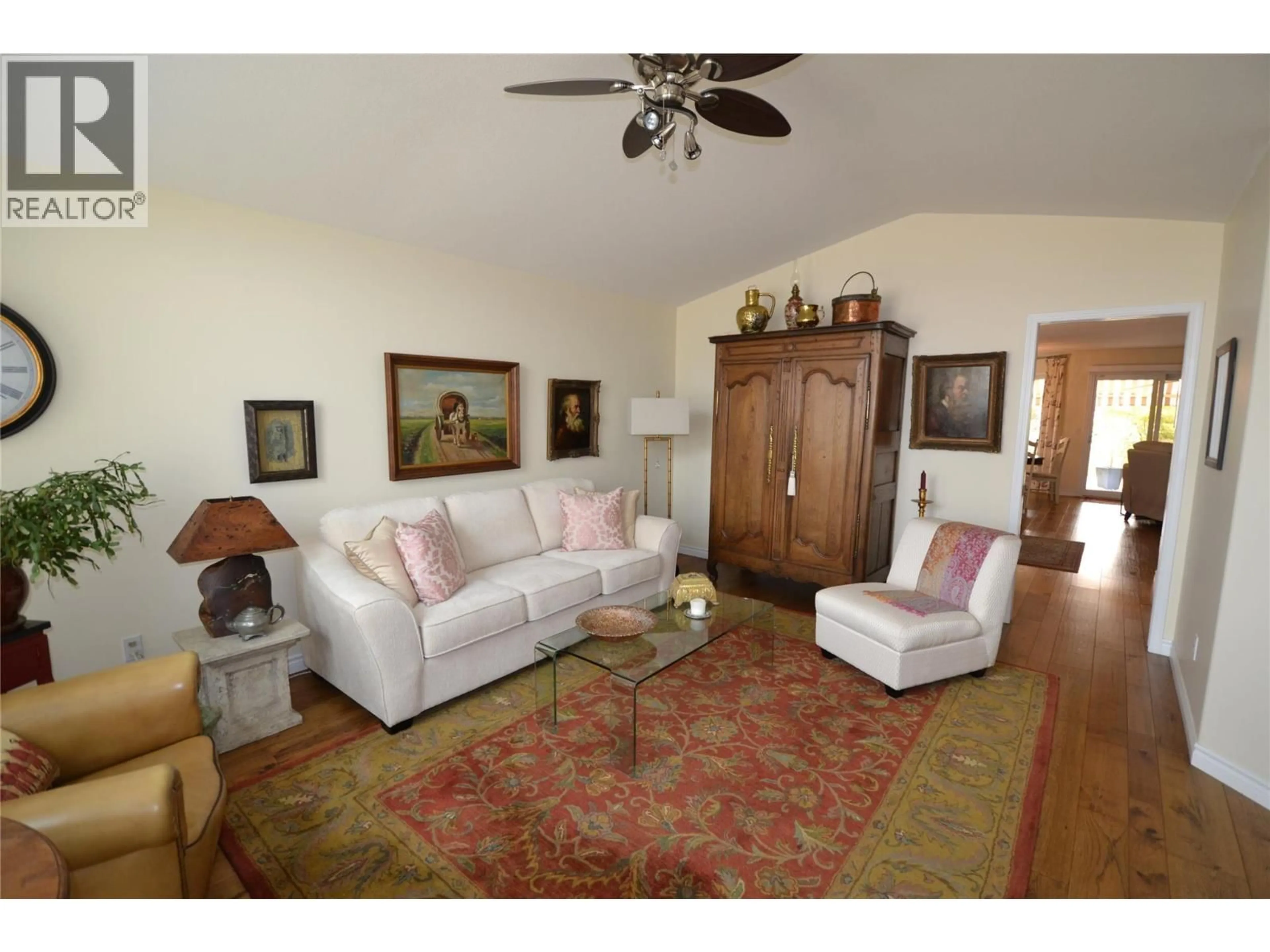Living room with furniture, wood/laminate floor for 239 - 2330 BUTT ROAD, West Kelowna British Columbia V4T2L3