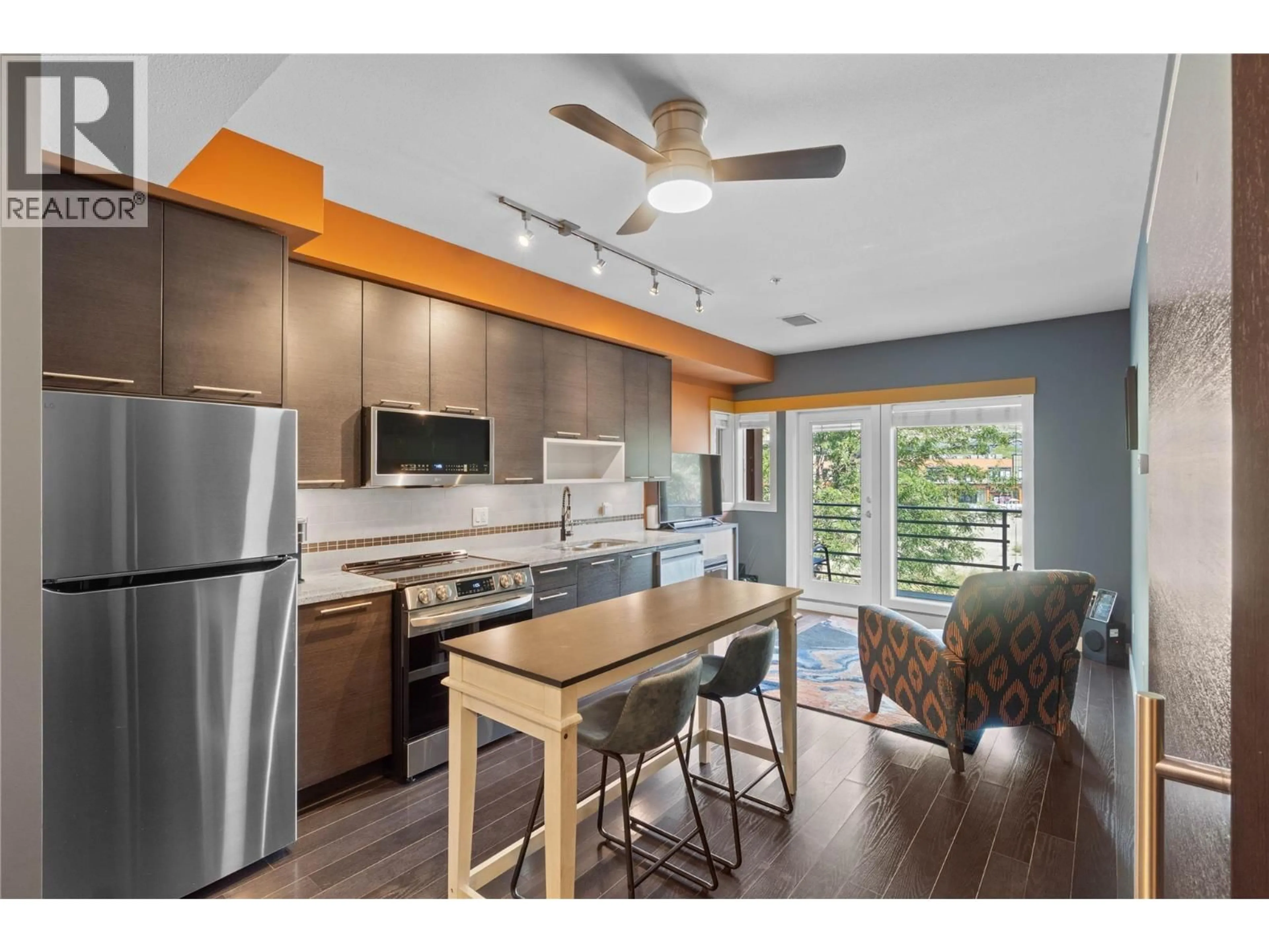 Open concept kitchen, wood/laminate floor for 2308 - 1030 TALASA WAY, Kamloops British Columbia V2H0C3