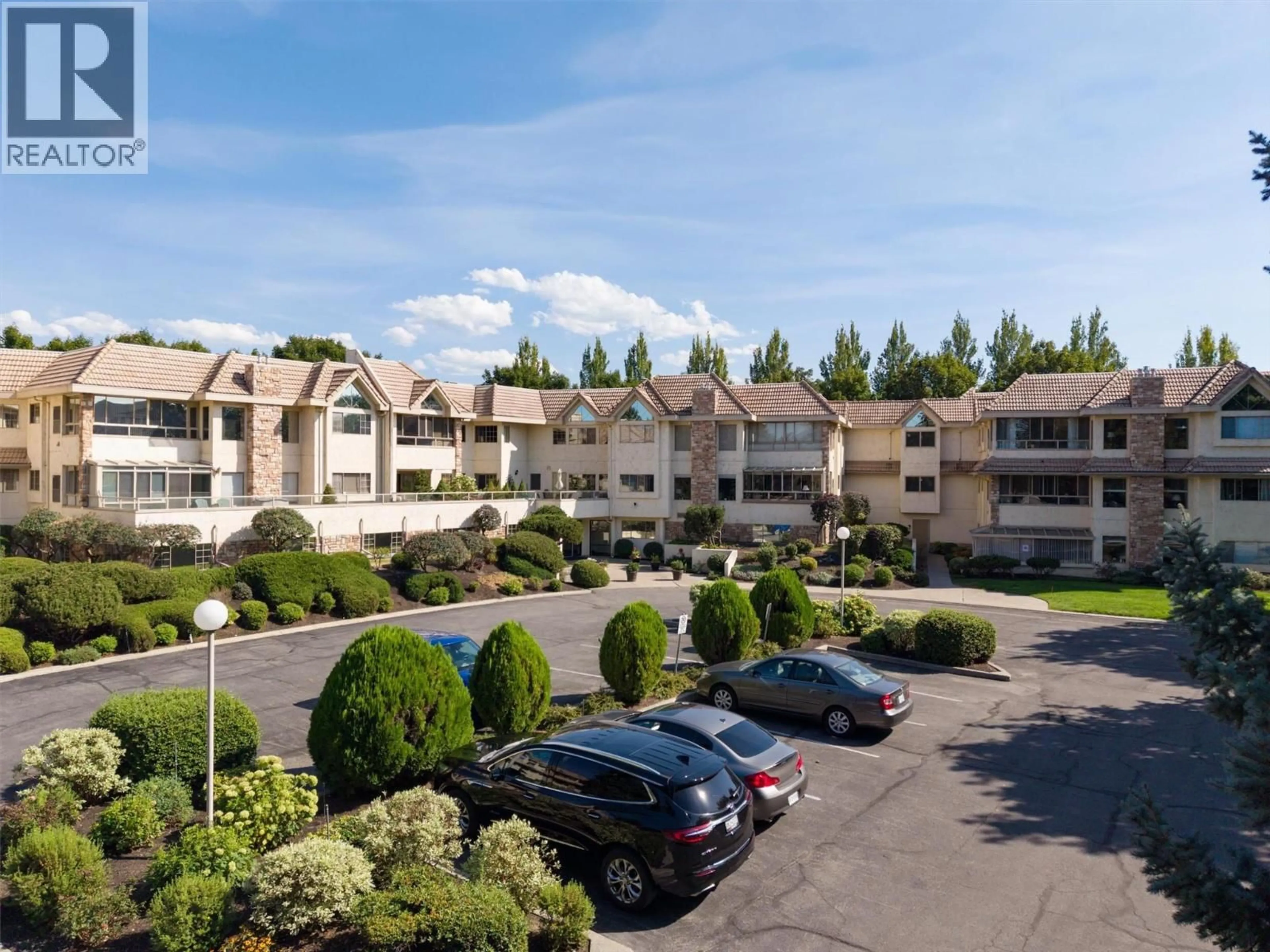 A pic from outside/outdoor area/front of a property/back of a property/a pic from drone, mountain view for 101 - 3335 RICHTER STREET, Kelowna British Columbia V1W3Y1