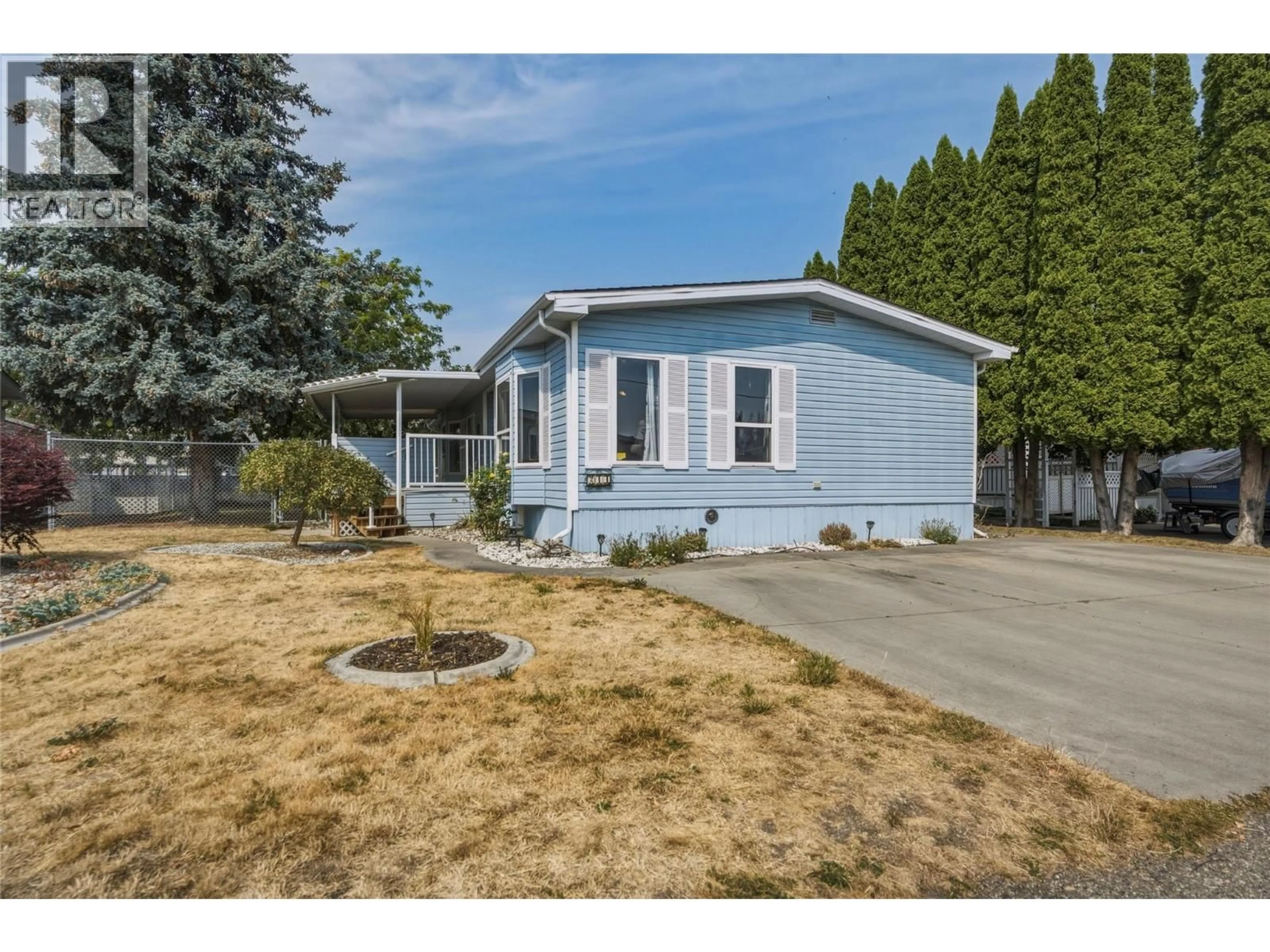 Home with vinyl exterior material, street for #214 - 6710 TRONSON ROAD OTHER, Vernon British Columbia V1H1X6
