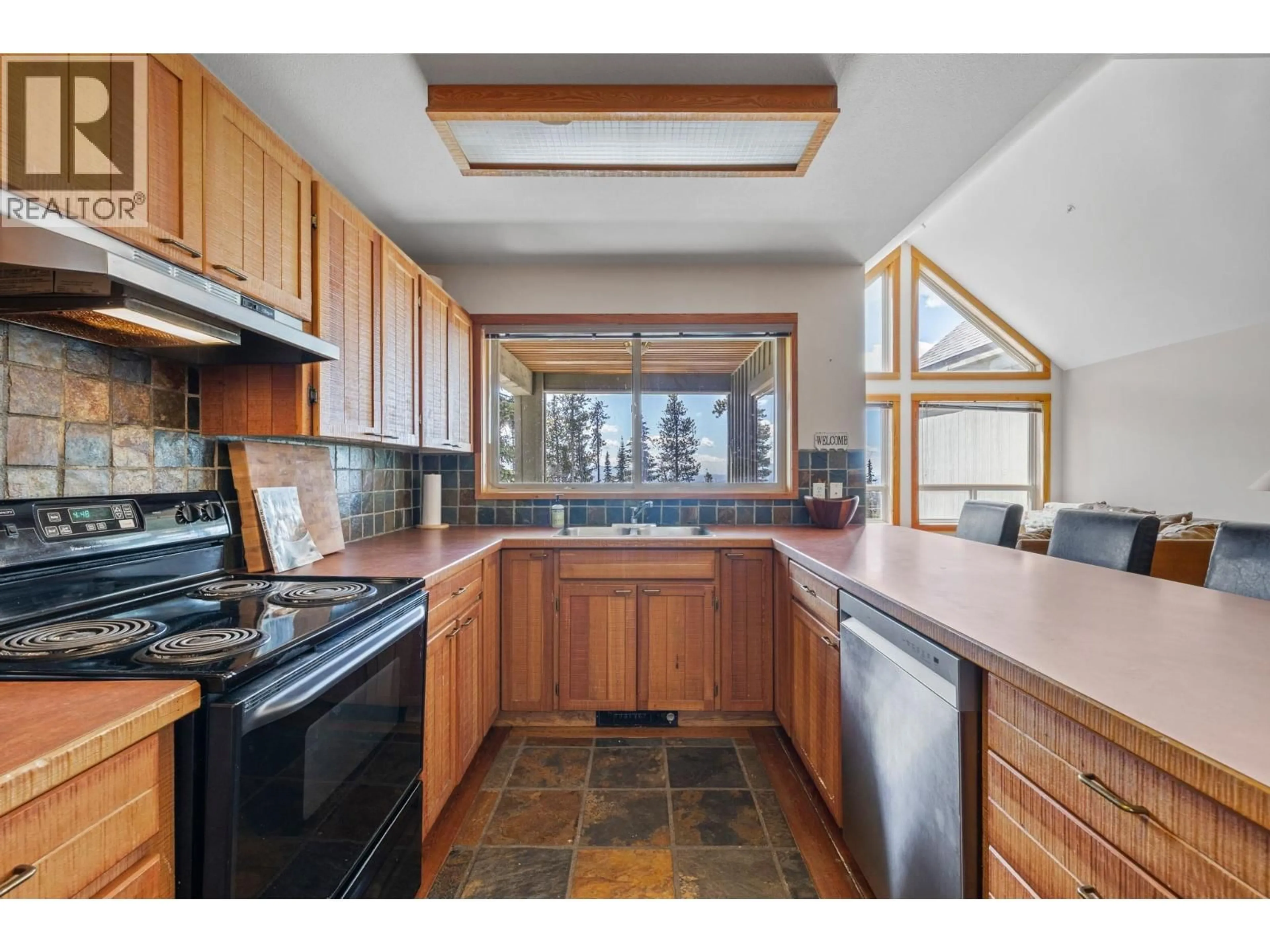Standard kitchen, ceramic/tile floor for 4879A SNOWPINES ROAD, Big White British Columbia V1P1P3