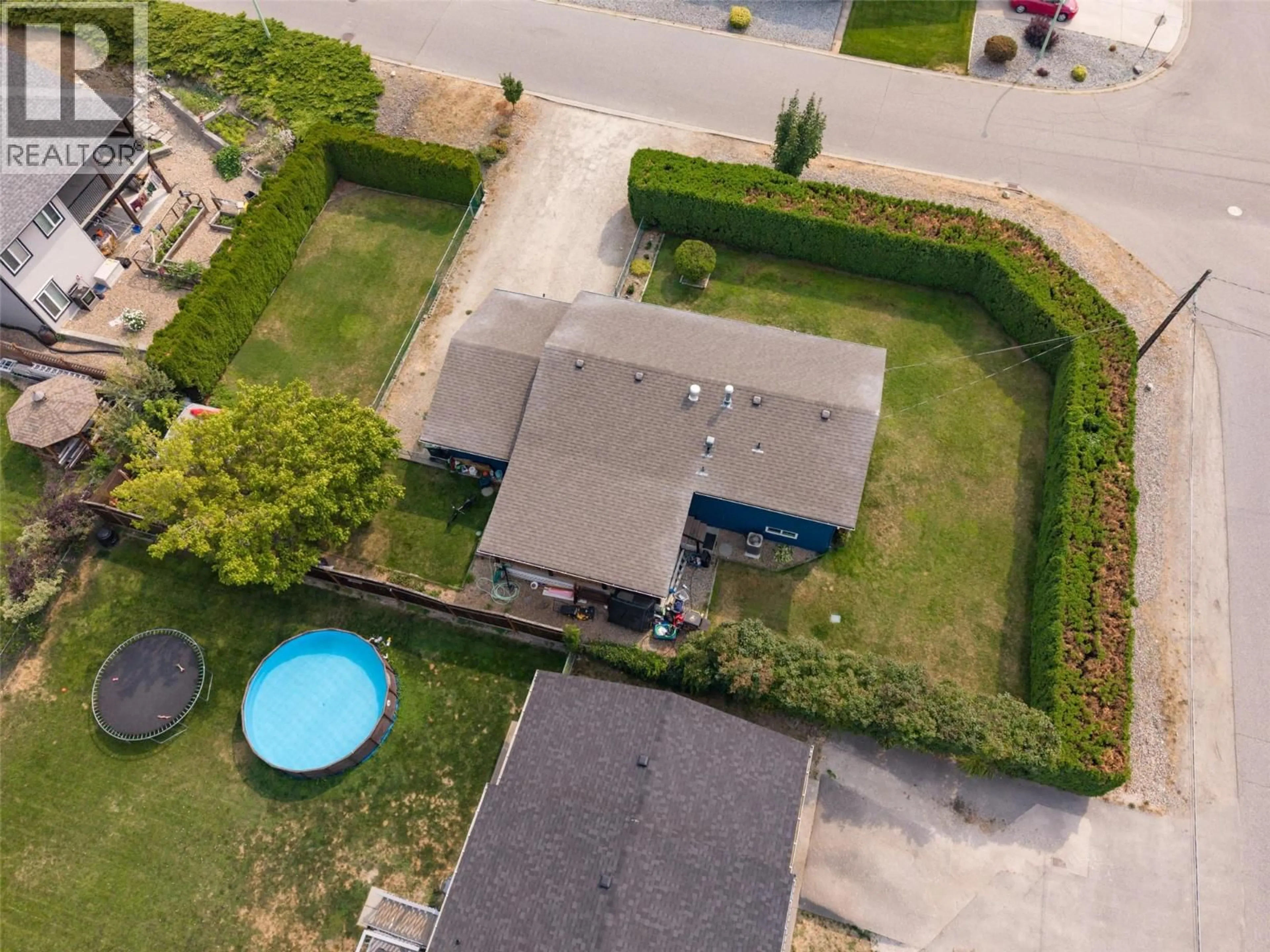 A pic from outside/outdoor area/front of a property/back of a property/a pic from drone, street for 680 MYRON ROAD, Kelowna British Columbia V1X5K2