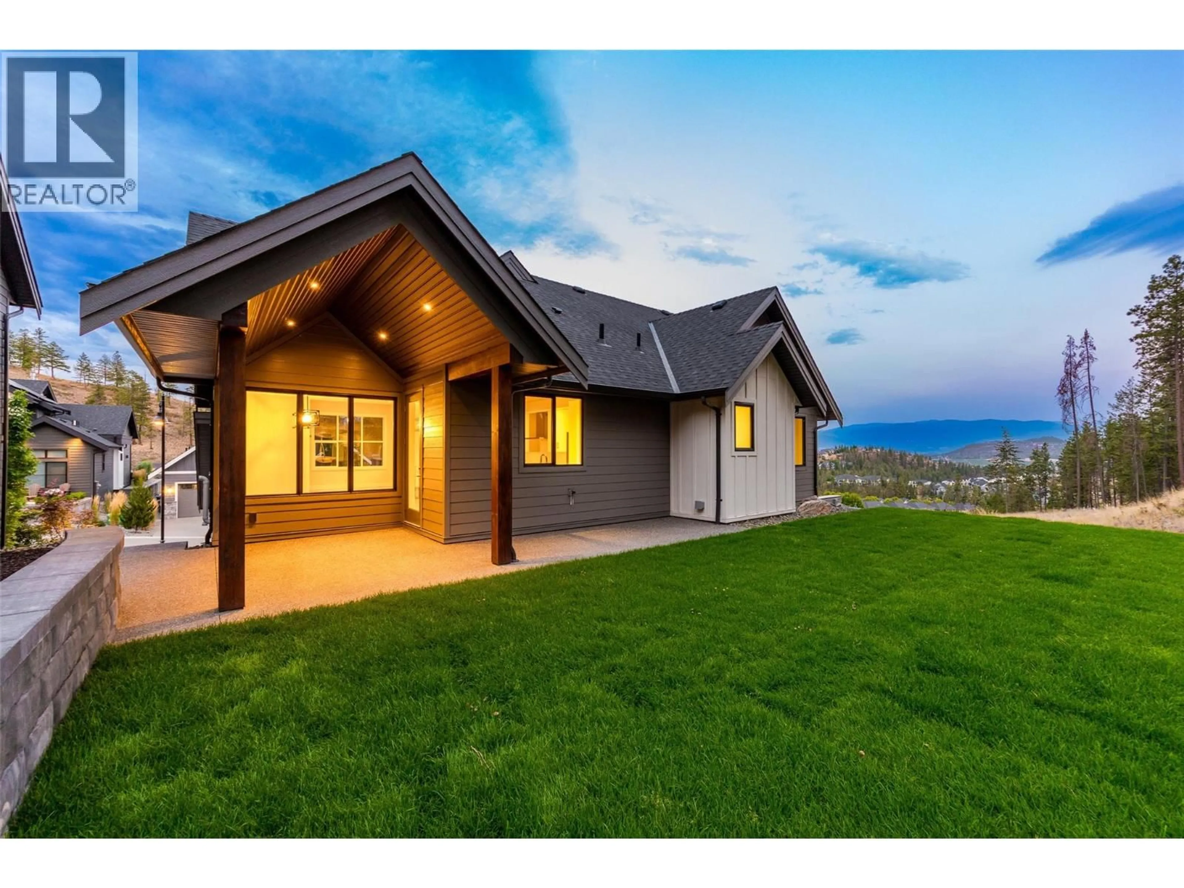 Home with vinyl exterior material, mountain view for 1448 WHISTLING PINE PLACE, Kelowna British Columbia V1V1H1