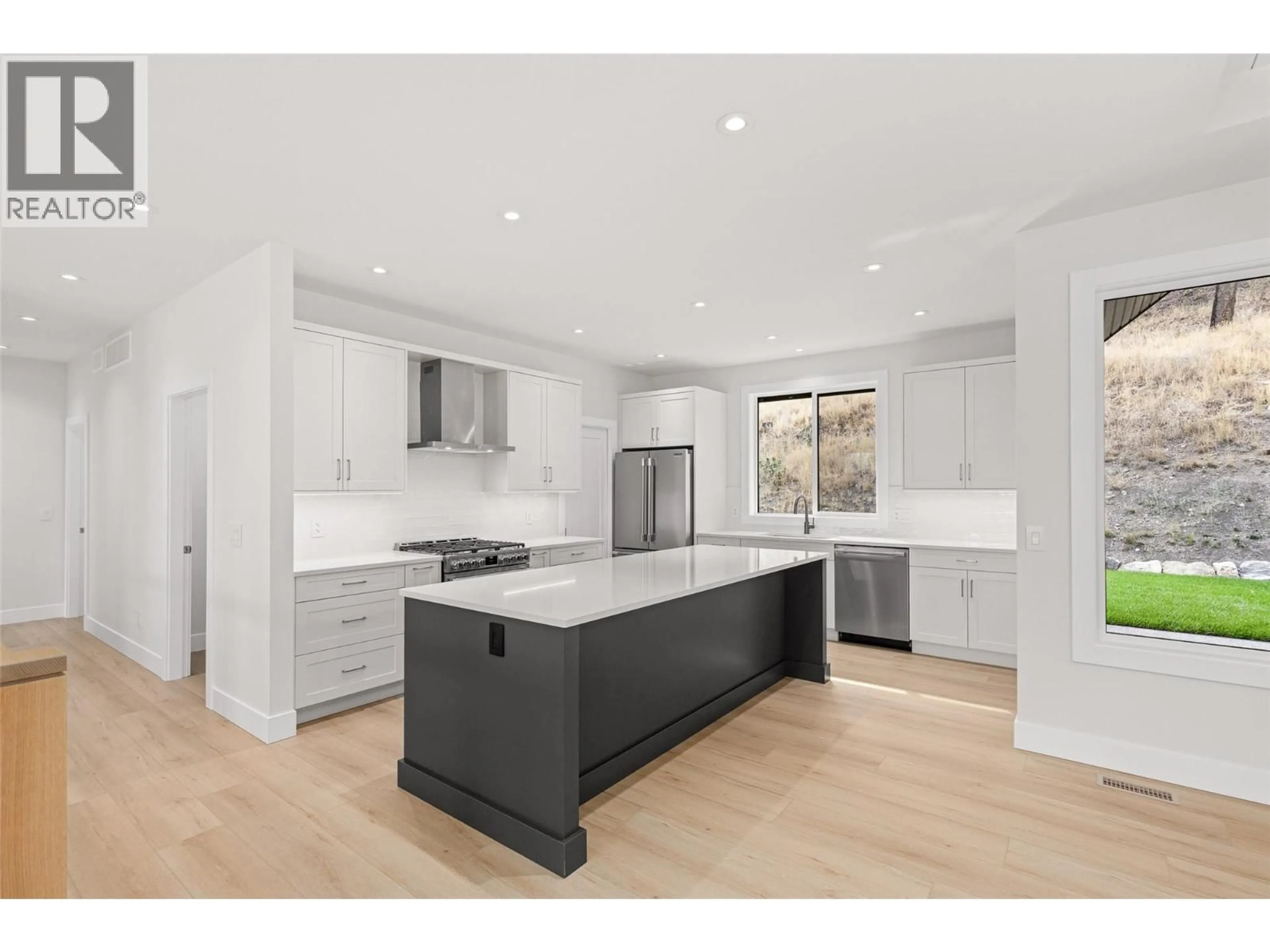 Open concept kitchen, unknown for 1448 WHISTLING PINE PLACE, Kelowna British Columbia V1V1H1