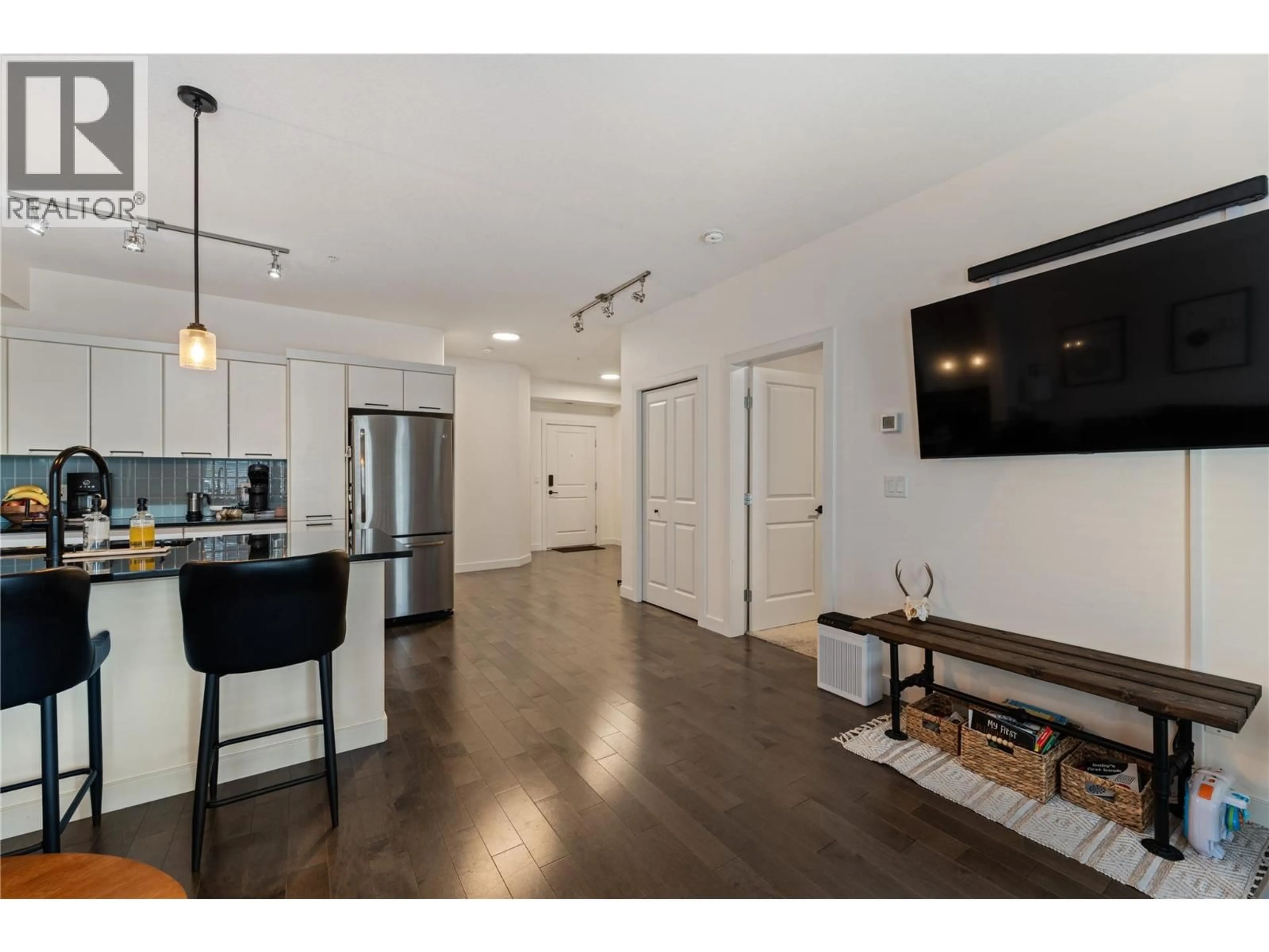 Open concept kitchen, wood/laminate floor for 310 - 3645 CARRINGTON ROAD, West Kelowna British Columbia V4T3G9