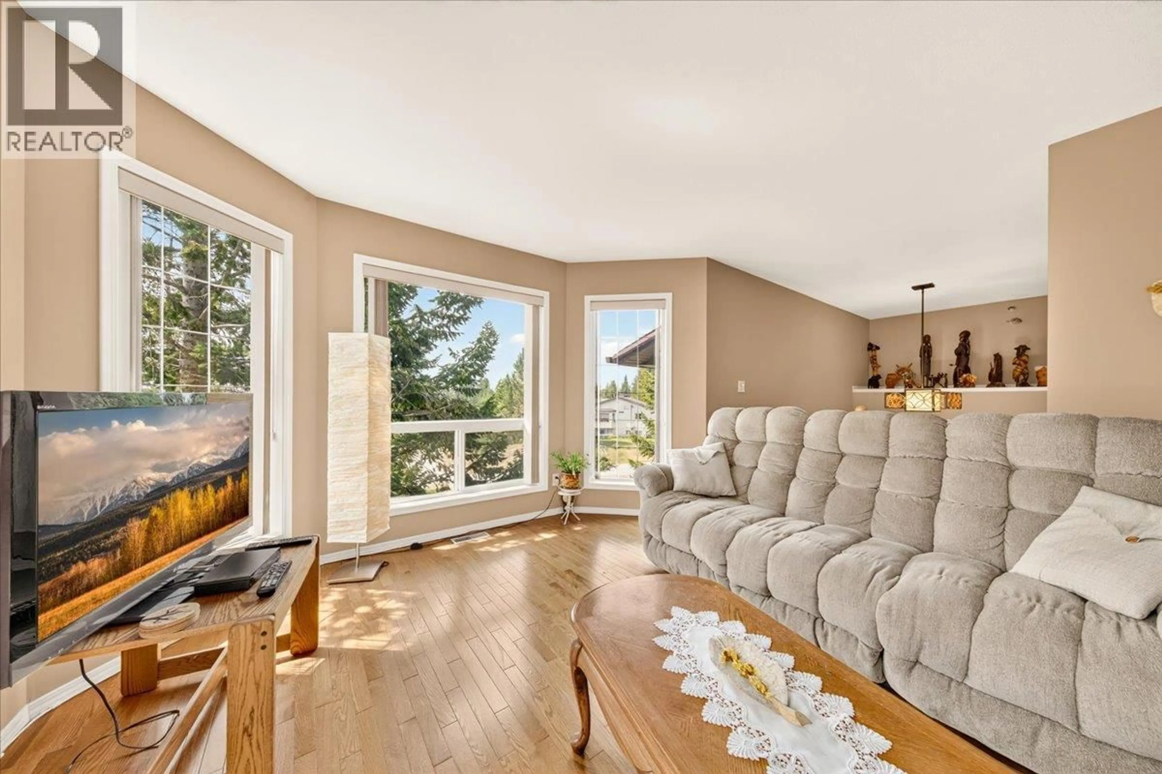Living room with furniture, wood/laminate floor for 20B WOLF CRESCENT, Windermere British Columbia V0A1K2