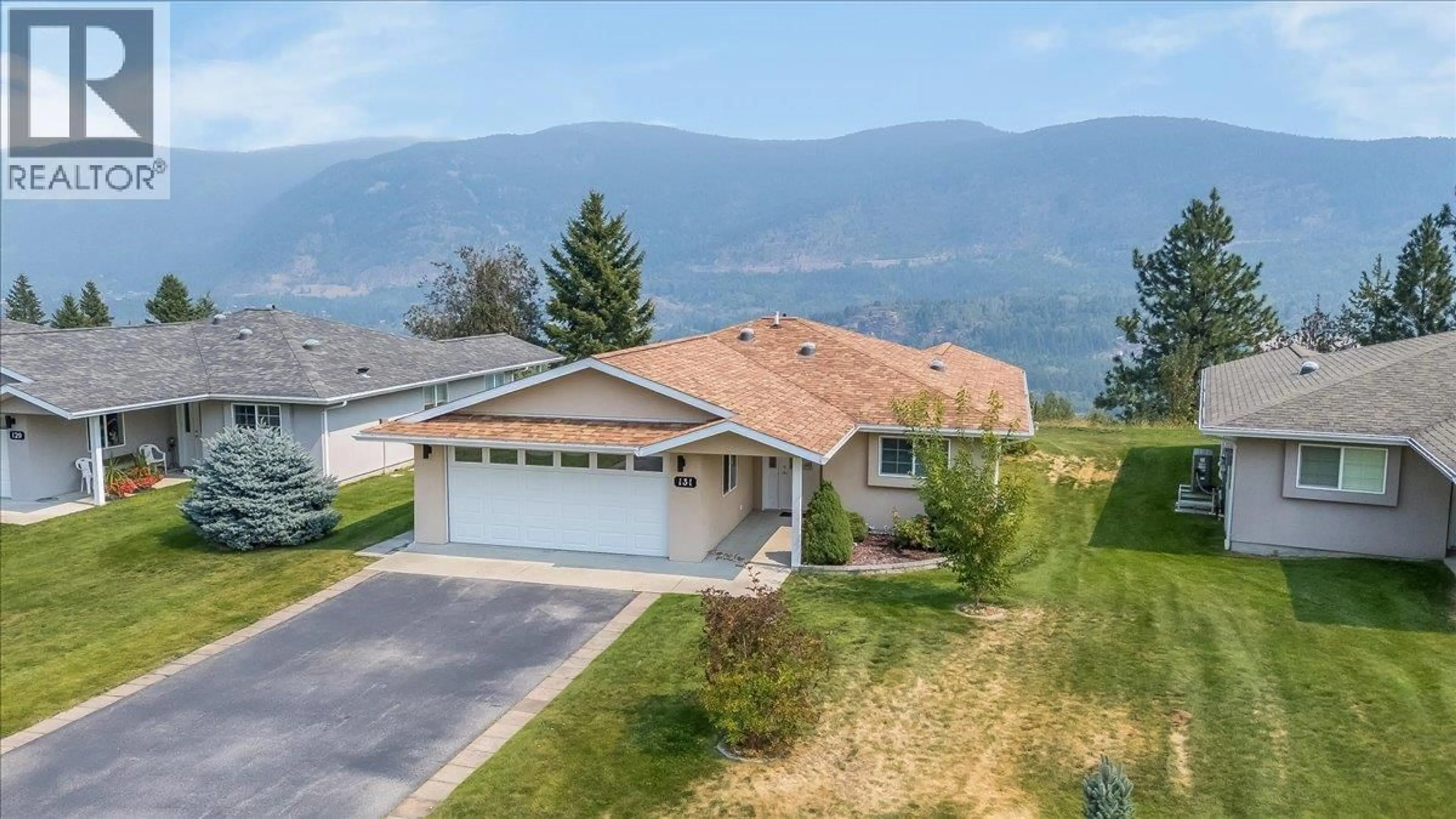 A pic from outside/outdoor area/front of a property/back of a property/a pic from drone, mountain view for 131 - 4200 GRANDVIEW DRIVE, Castlegar British Columbia V1N4X6