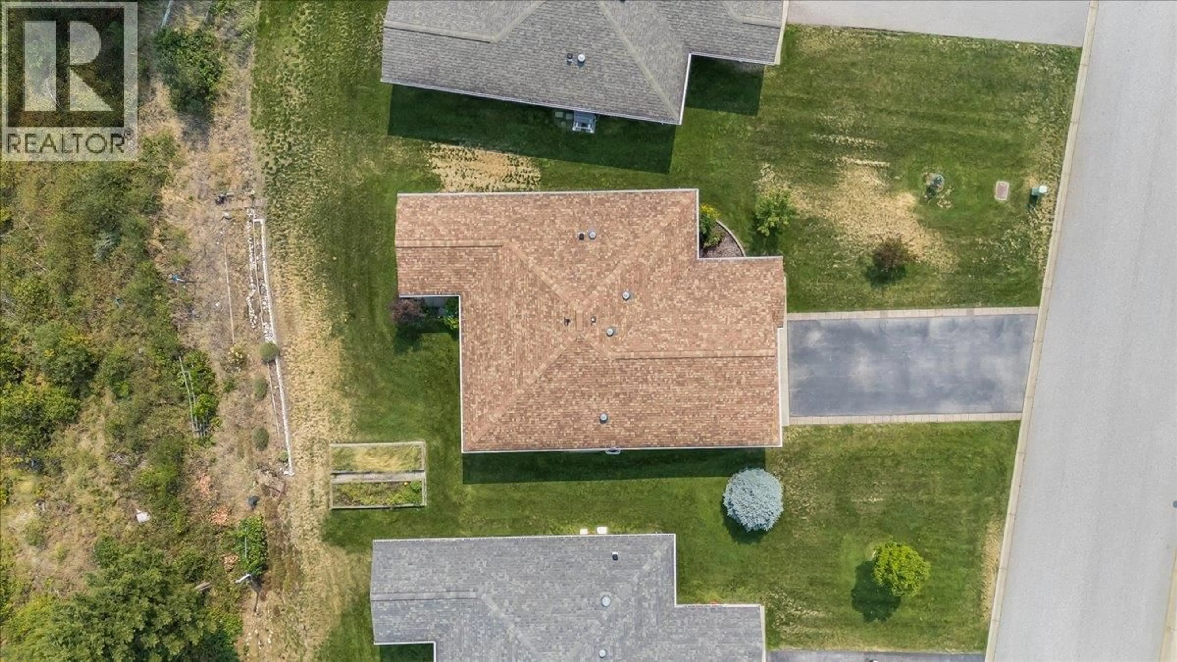A pic from outside/outdoor area/front of a property/back of a property/a pic from drone, street for 131 - 4200 GRANDVIEW DRIVE, Castlegar British Columbia V1N4X6
