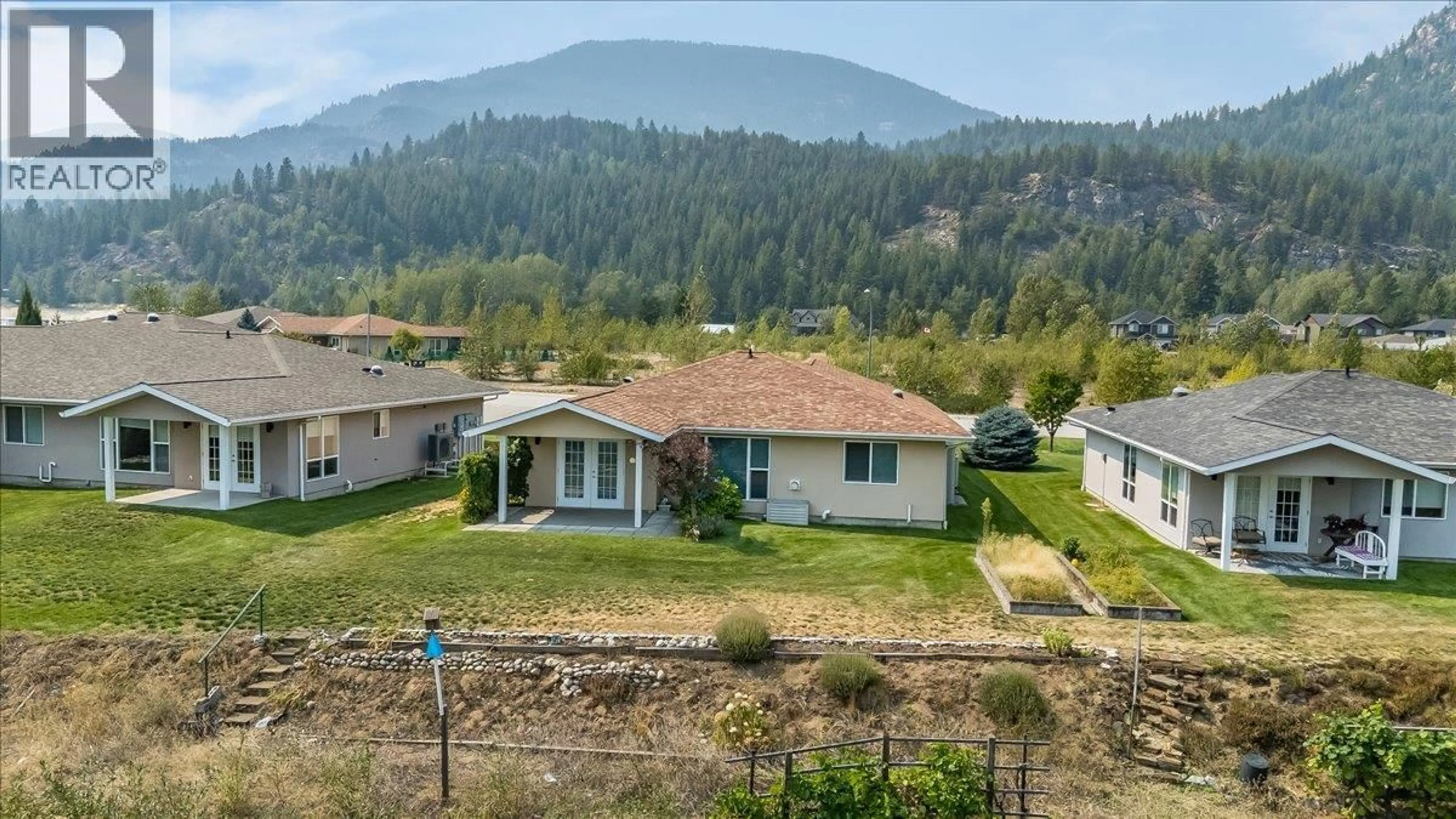 A pic from outside/outdoor area/front of a property/back of a property/a pic from drone, mountain view for 131 - 4200 GRANDVIEW DRIVE, Castlegar British Columbia V1N4X6