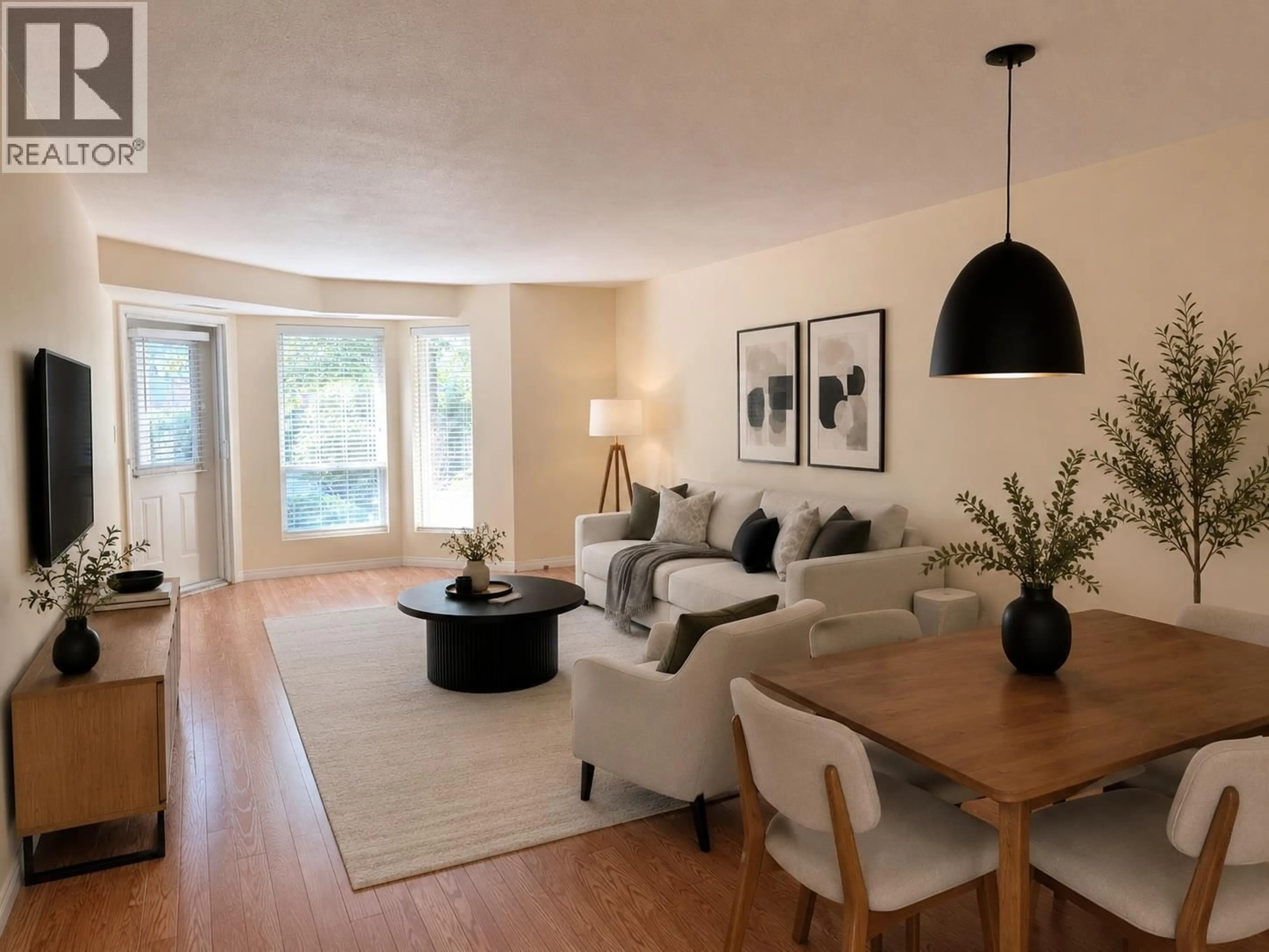 Living room with furniture, wood/laminate floor for 116 - 1965 DURNIN ROAD, Kelowna British Columbia V1X7K6